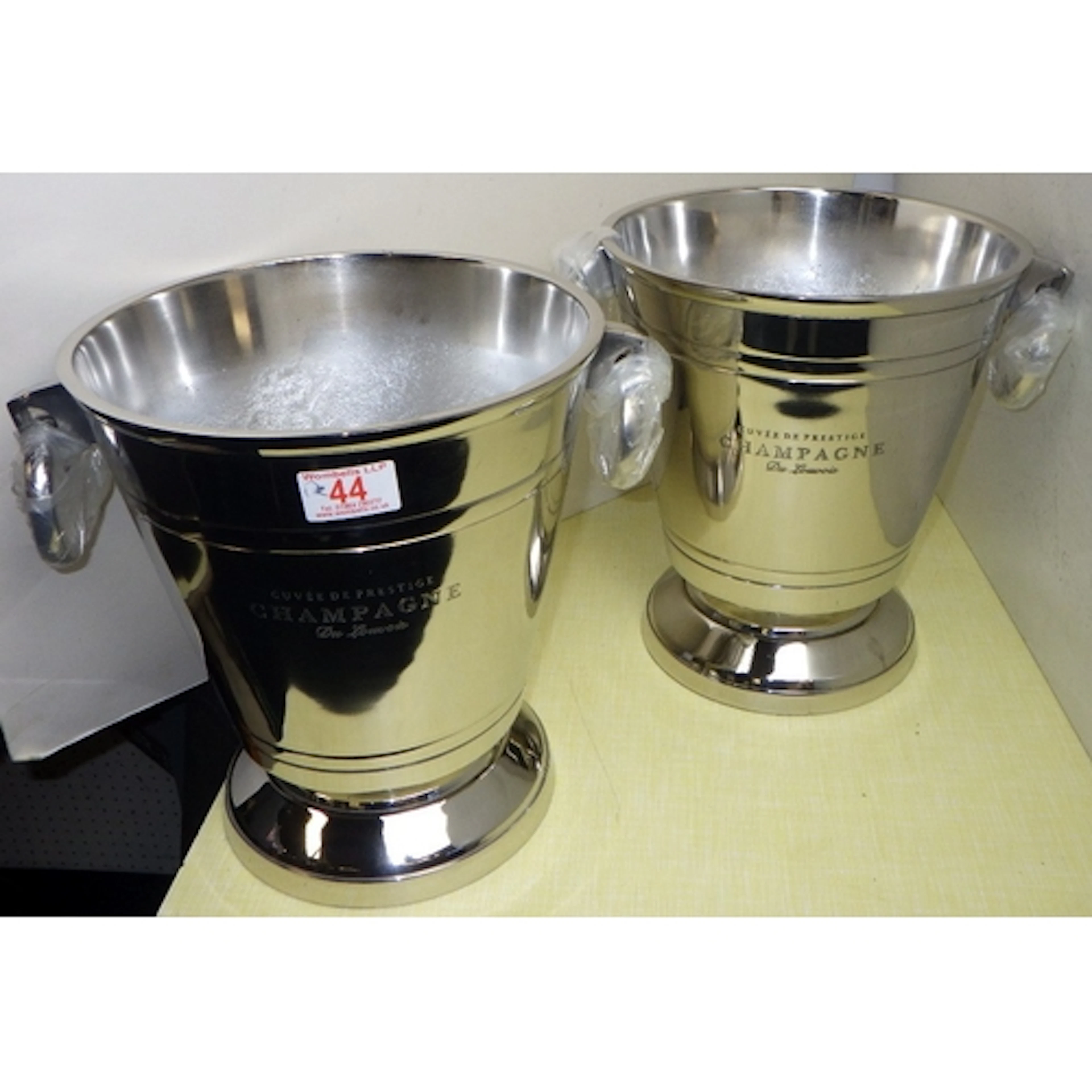 A pair of plated Champagne buckets, 28cm tall