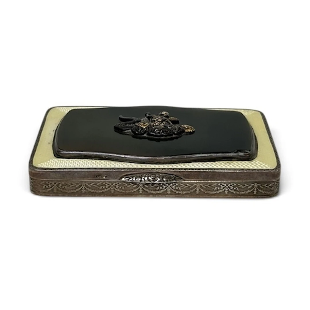 A JAPANESE SILVER AND SHAKUDO CIGARETTE BOX 9cm Width...
