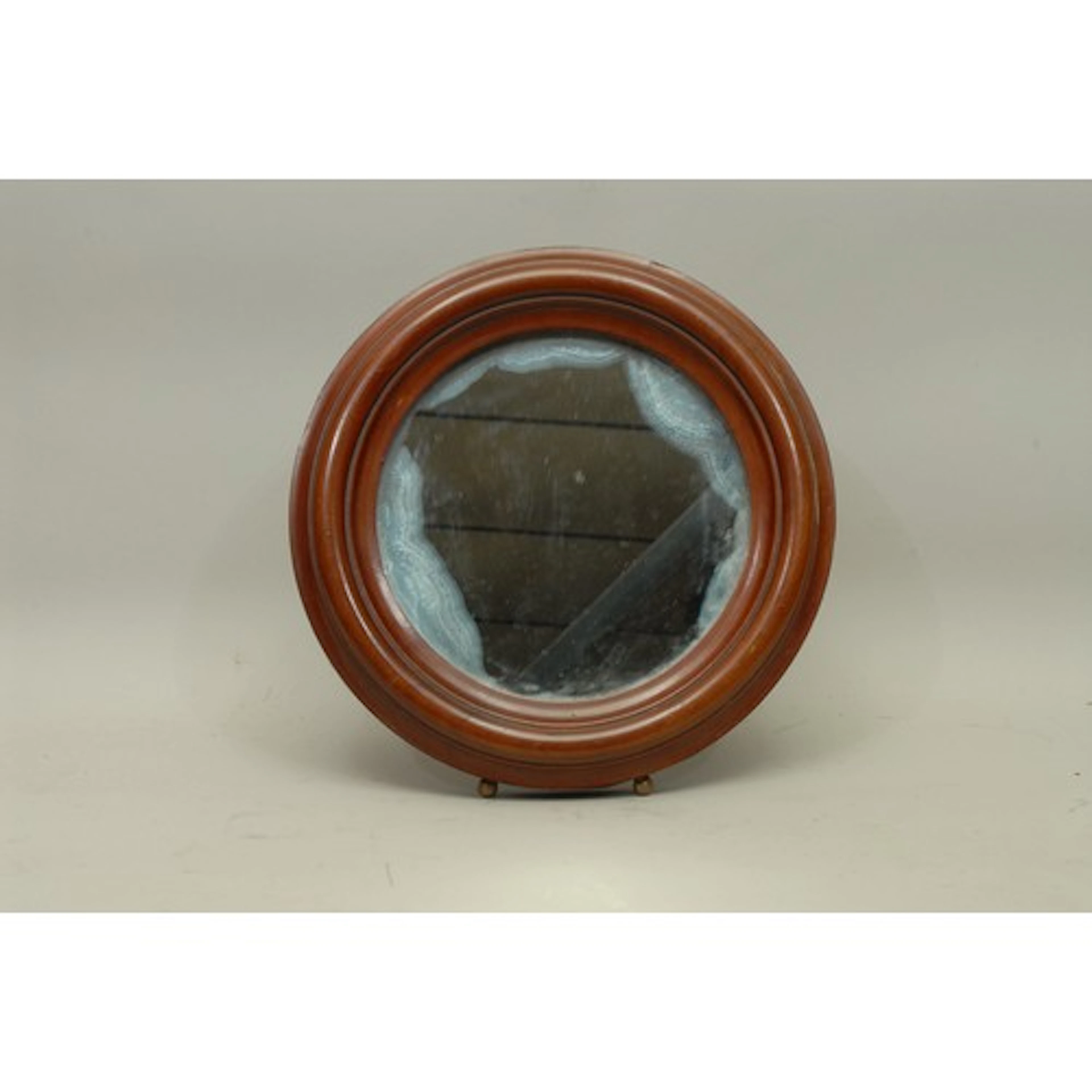 A 19th century mahogany country house circular easel mirror,...