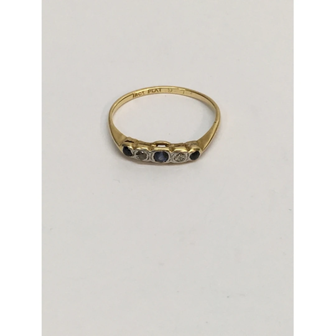 An 18ct gold plat. ring set with band of small blue and whit...