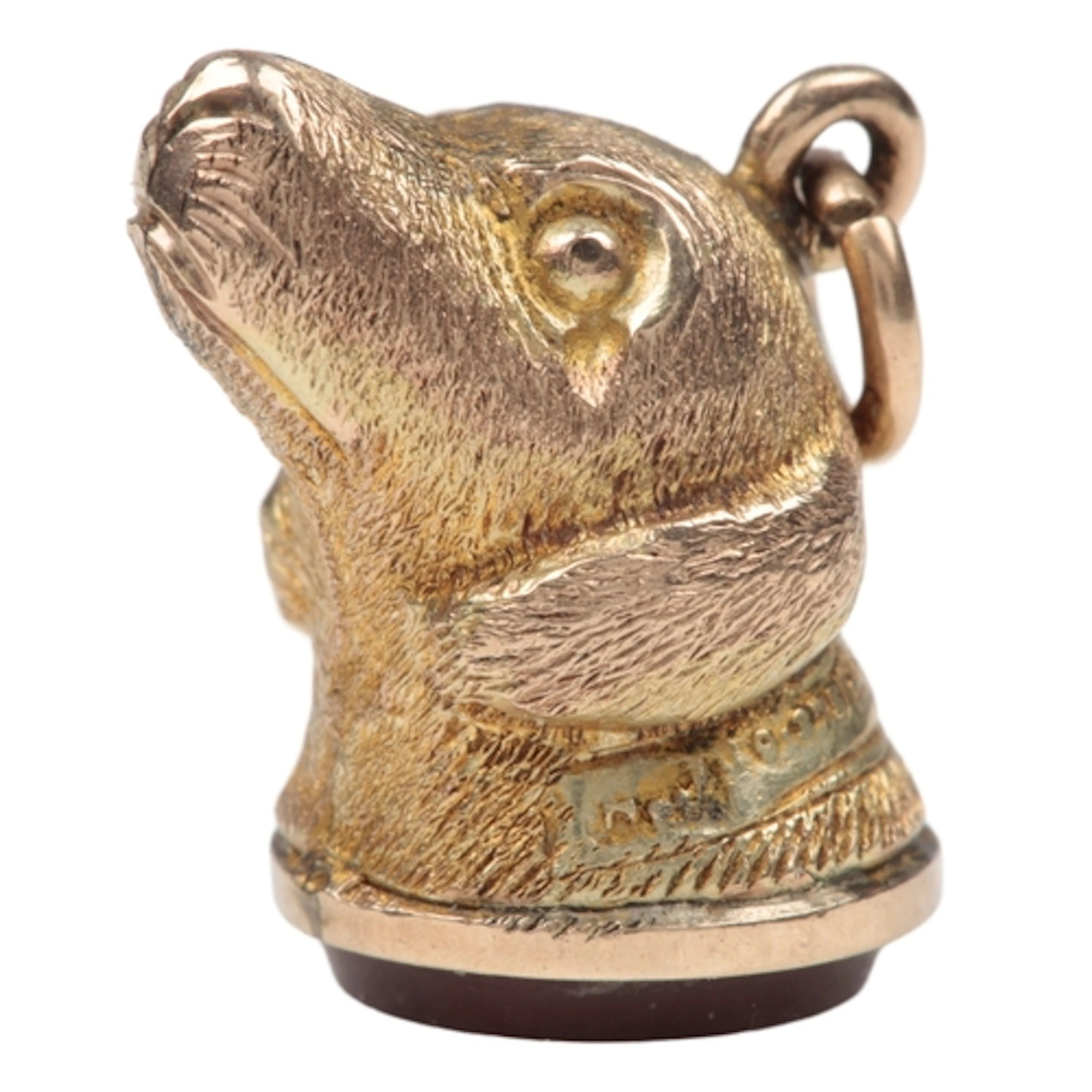 A gold and onyx seal charm, early 20th century, designed as ...