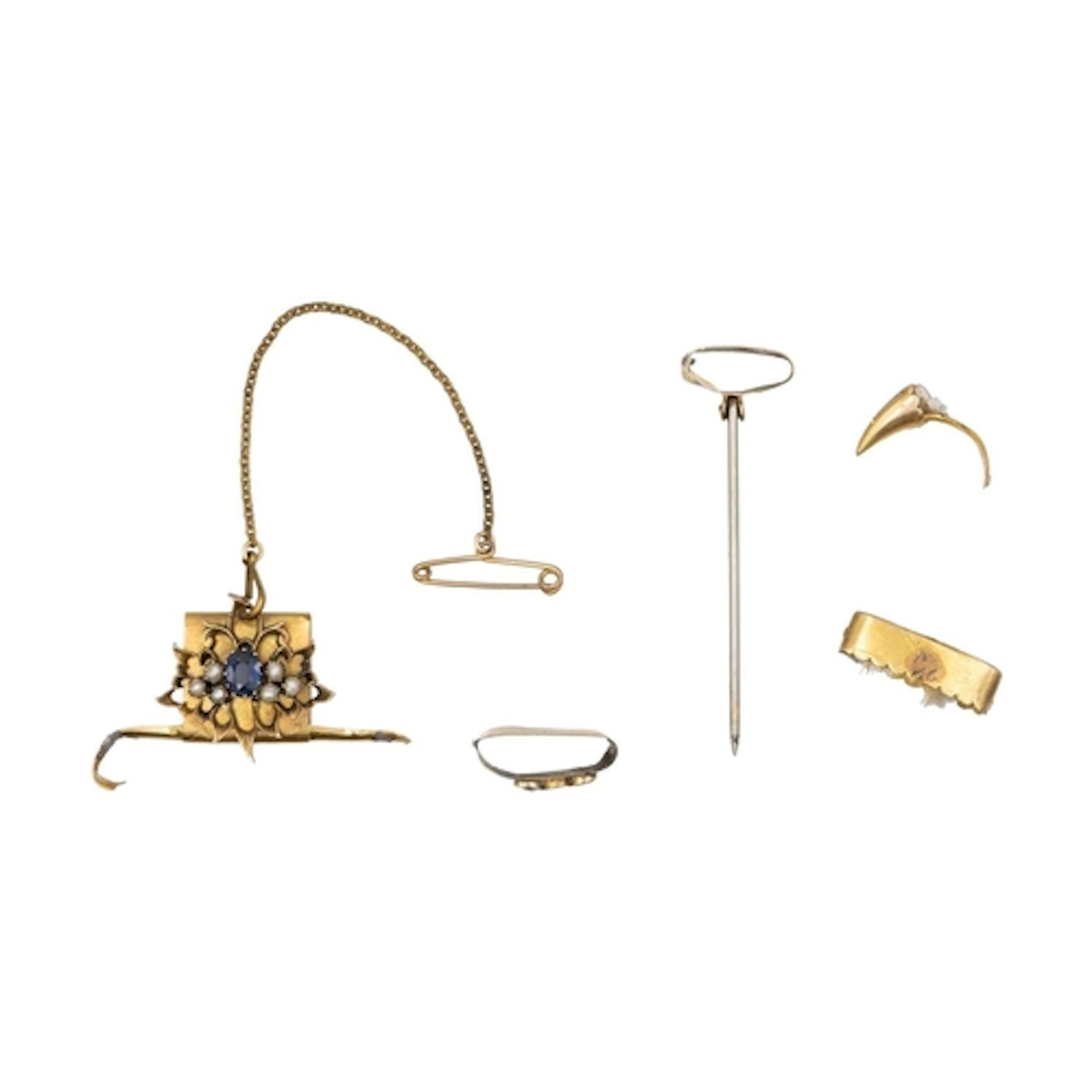 A collection of scrap gold fittings from two big cat claw je...