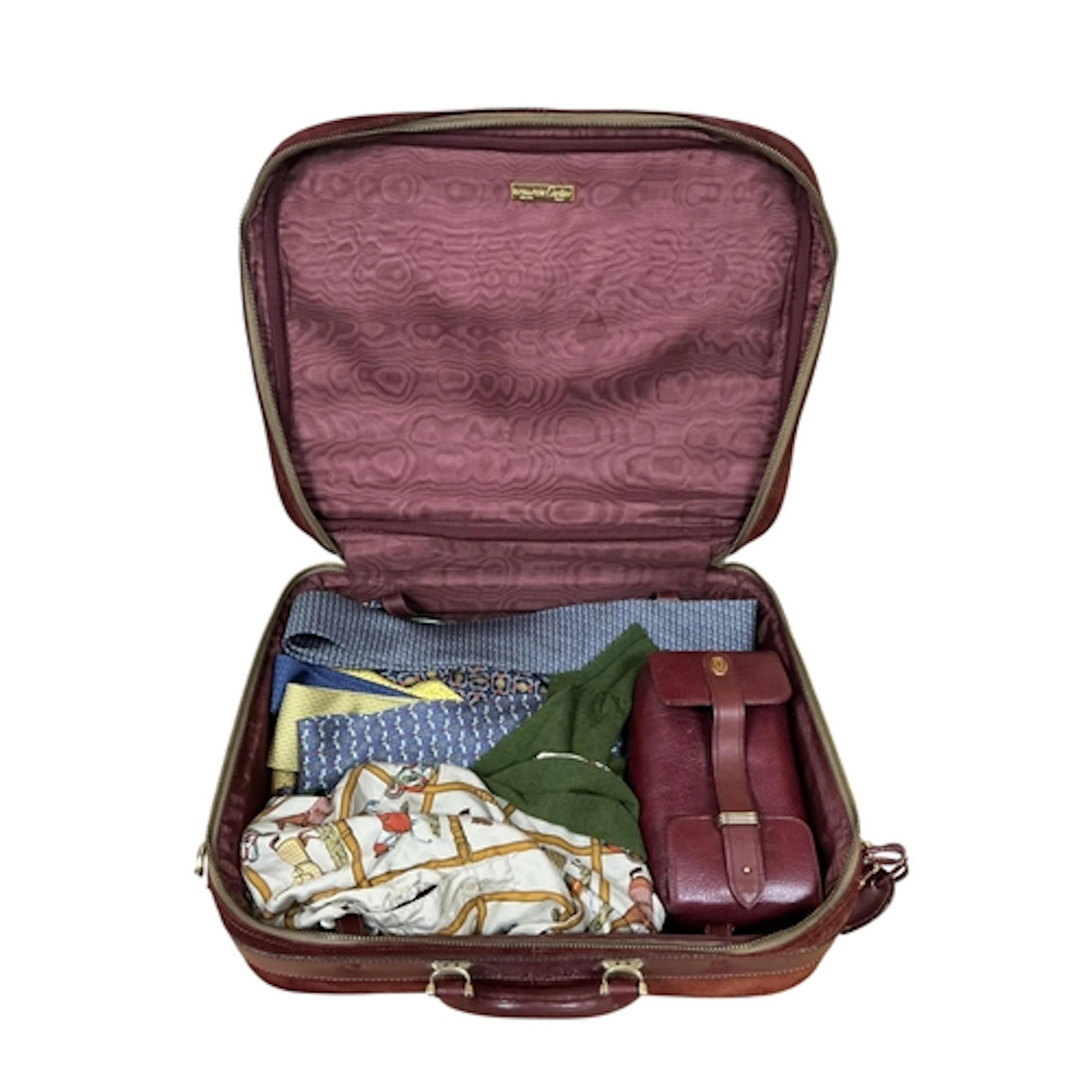 A Cartier suitcase and wash bag, with a collection a Hermes ...