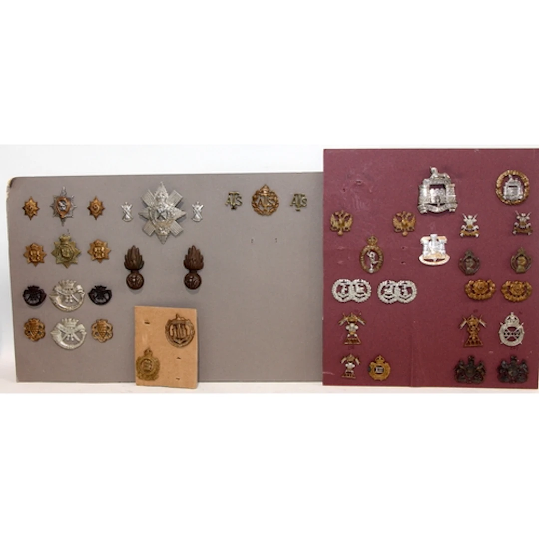 A good carded selection of military cap badges, various eras...