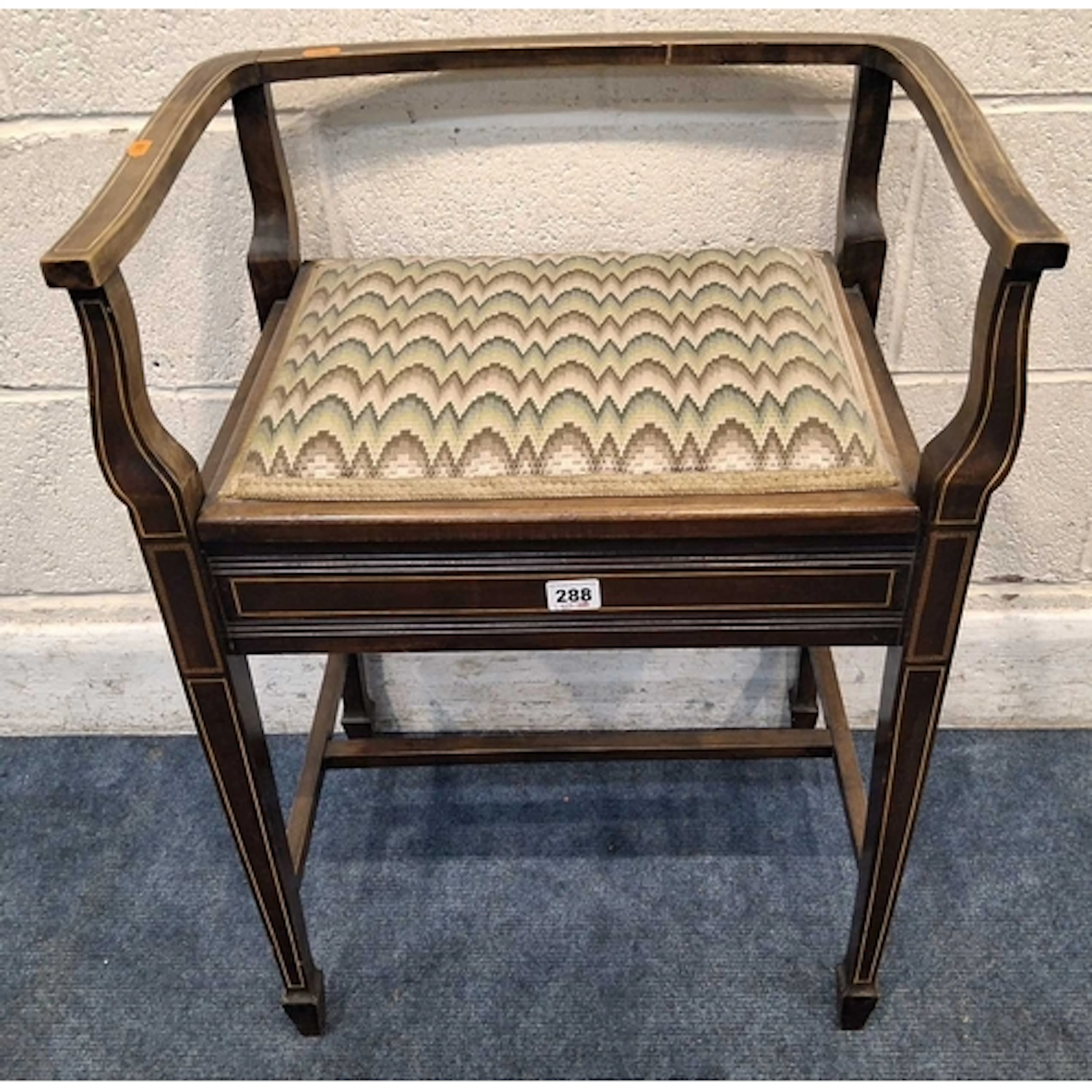AN EDWARDIAN MAHOGANY AND BOX STRUNG PIANO STOOL with open b...