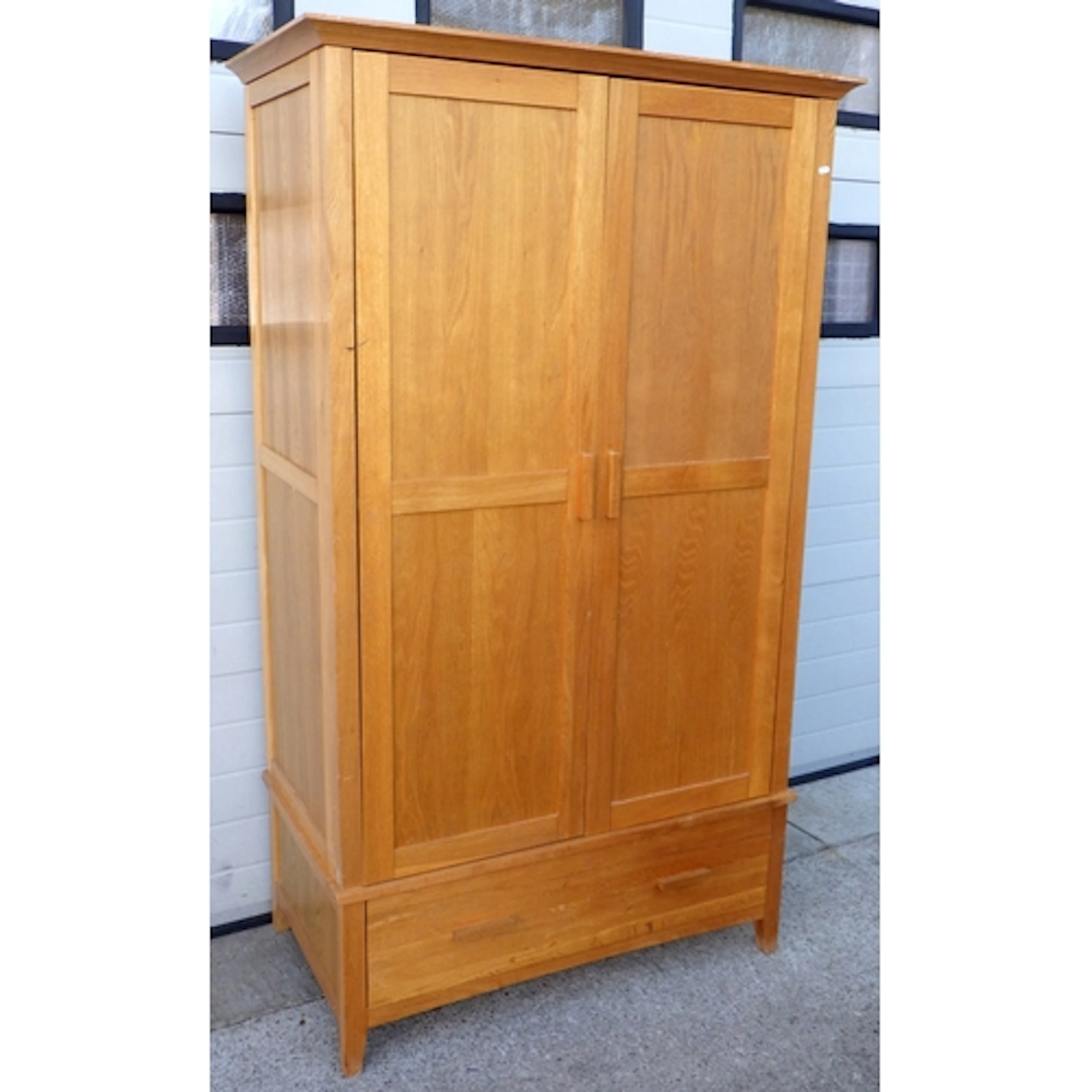 A modern oak wardrobe with lower drawer, 115cm wide, 199cm t...