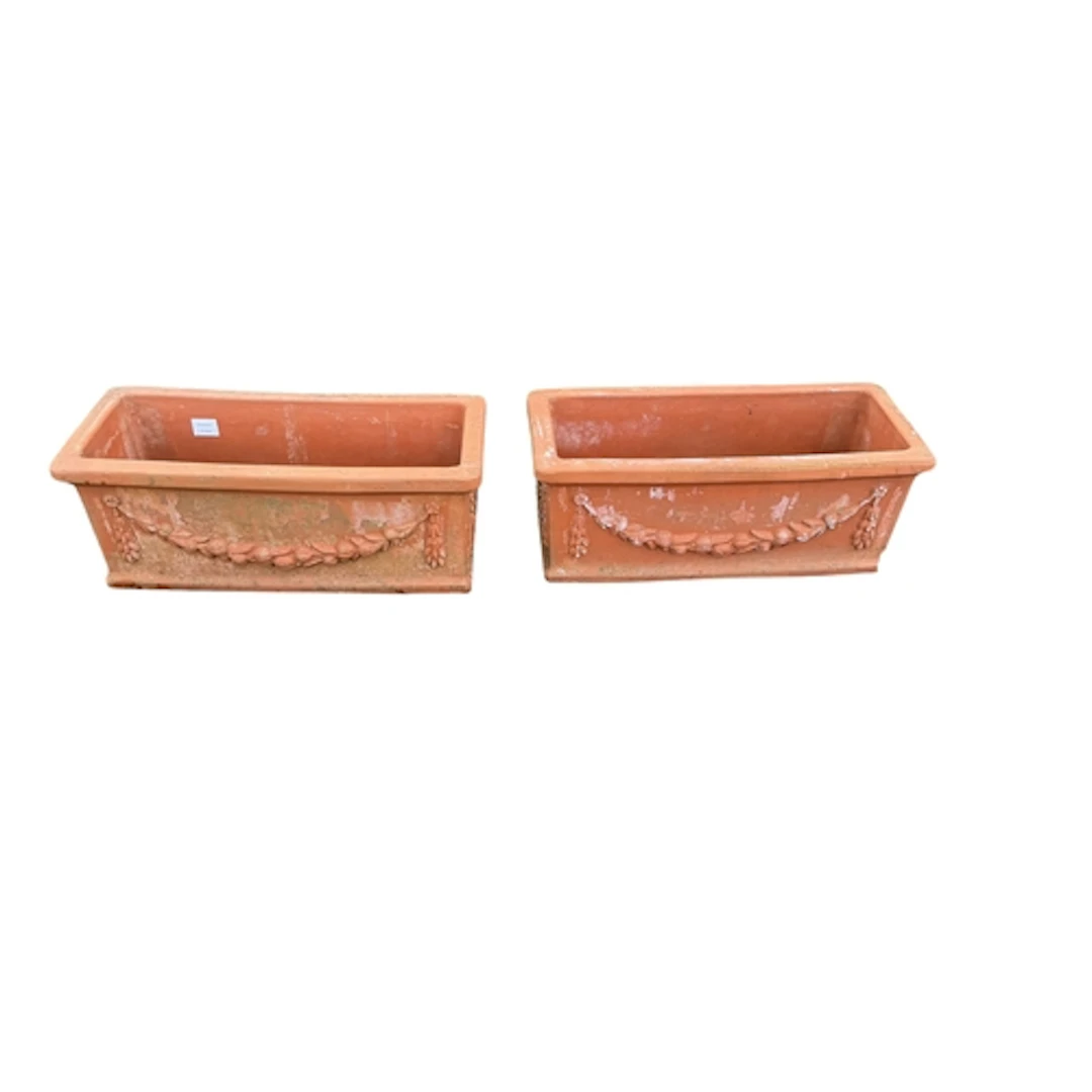 A pair of terracotta square planters, with swag decoration, ...