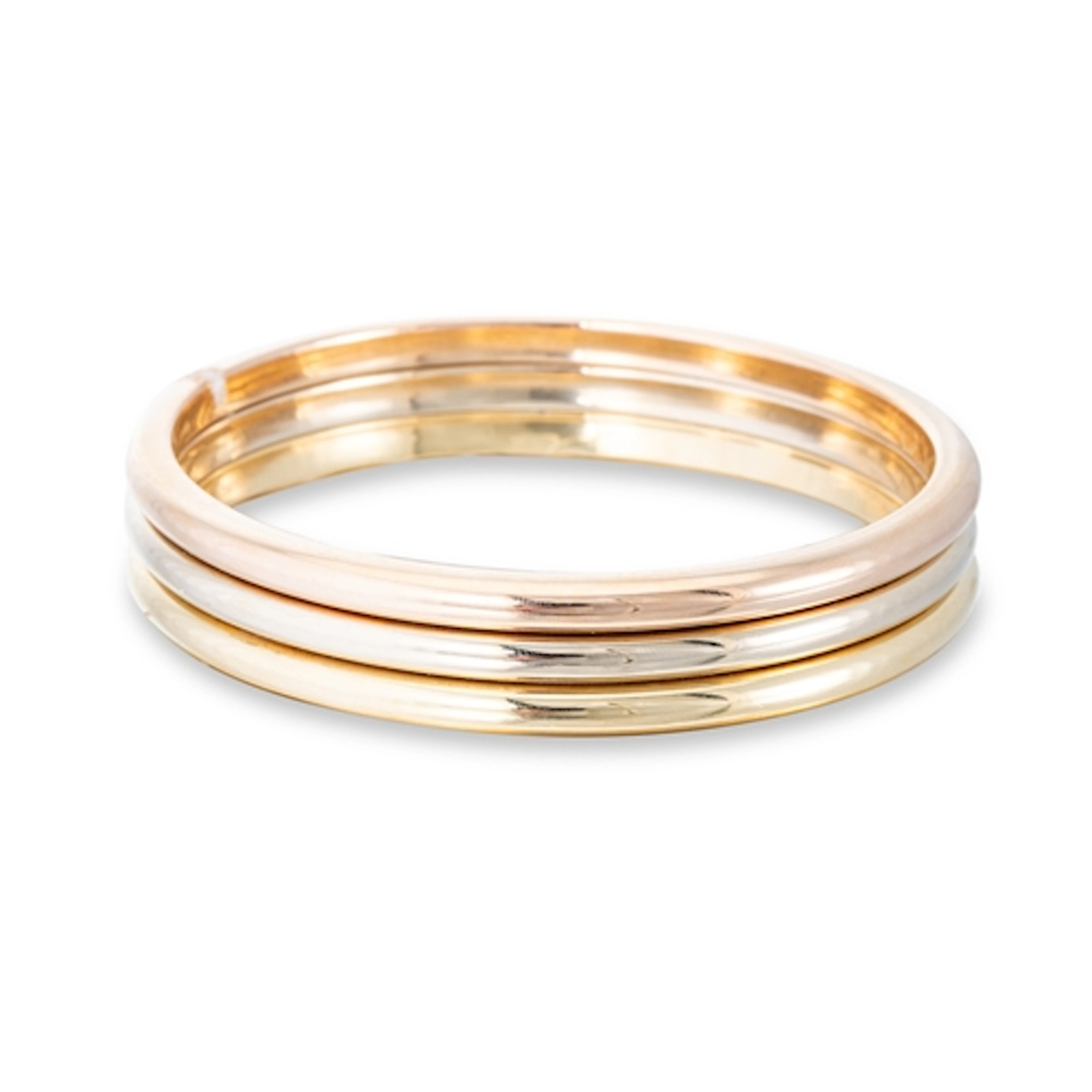 AN UNUSUAL CARTIER TRINITY BANGLE, the three bands stacked w...
