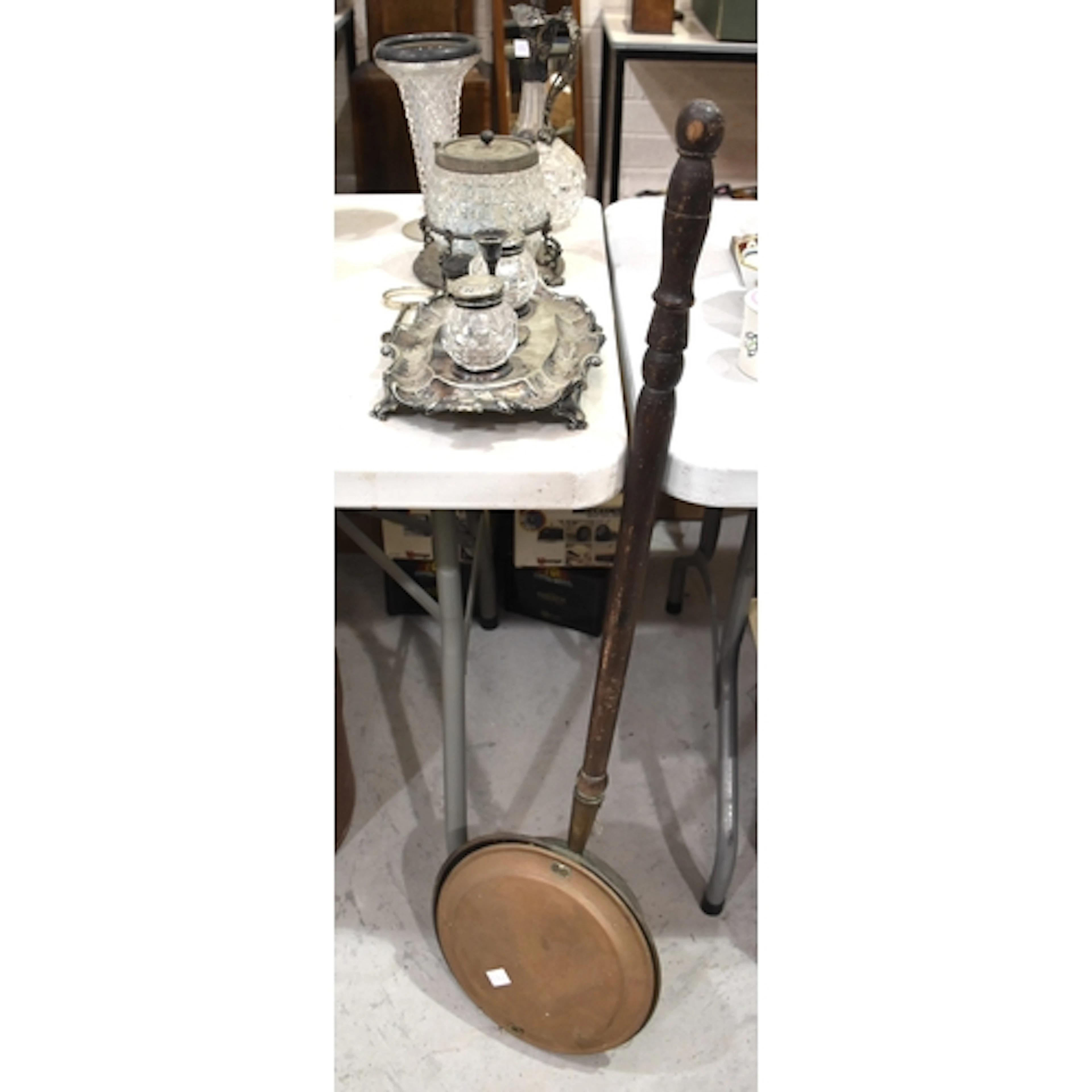 A copper warming pan with turned wood handle, a plated stand...