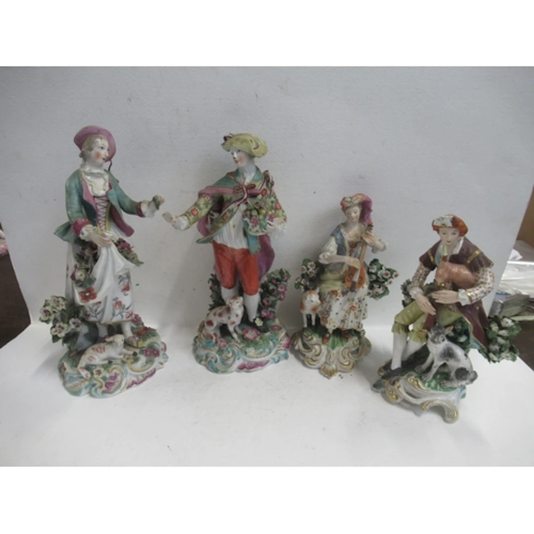 Two pairs of 19th century porcelain figures, one pair with g...