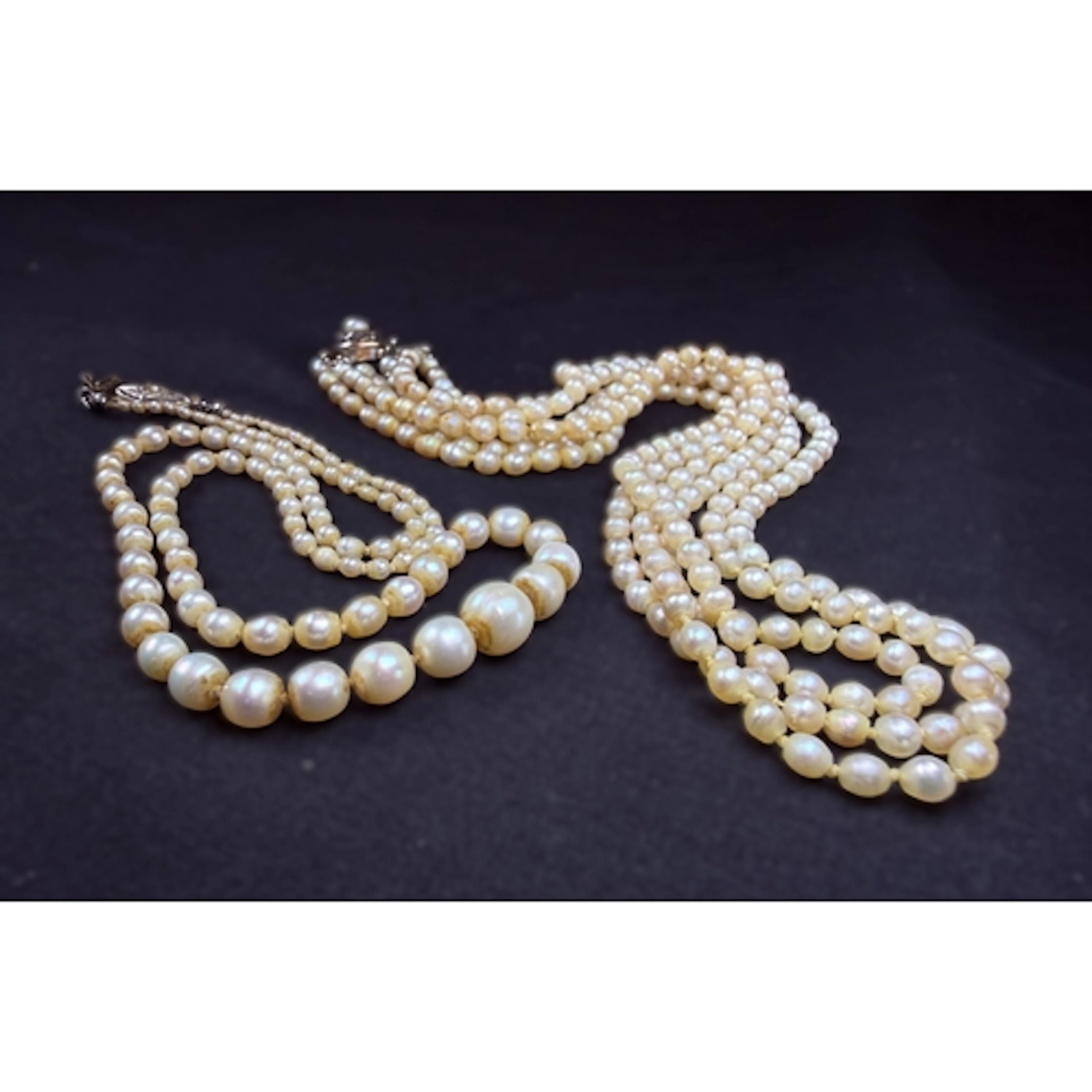 An Art Deco three strand natural pearl collar with yellow me...