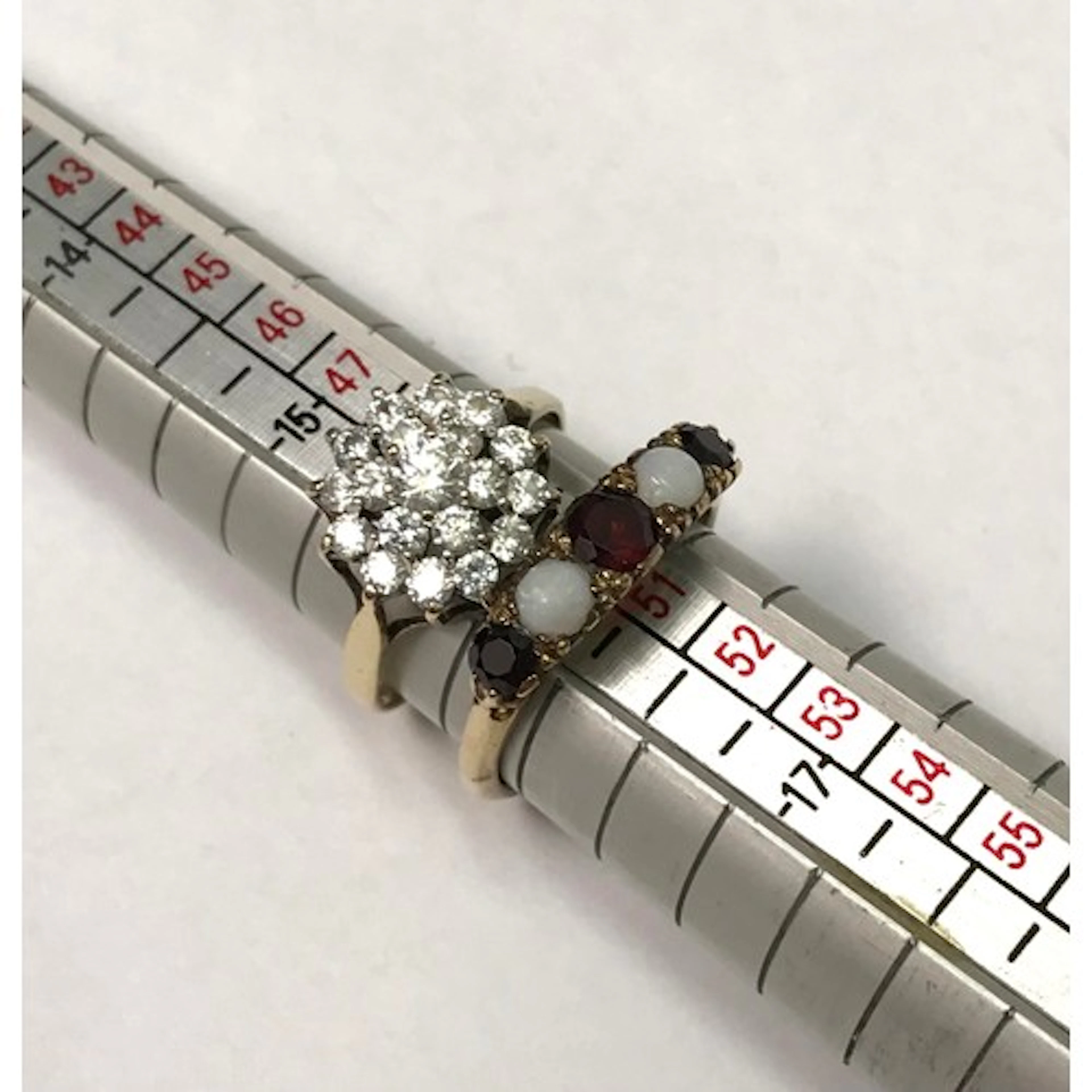 An opal and ruby five stone ring, 9ct gold; a 9ct gold cubic...