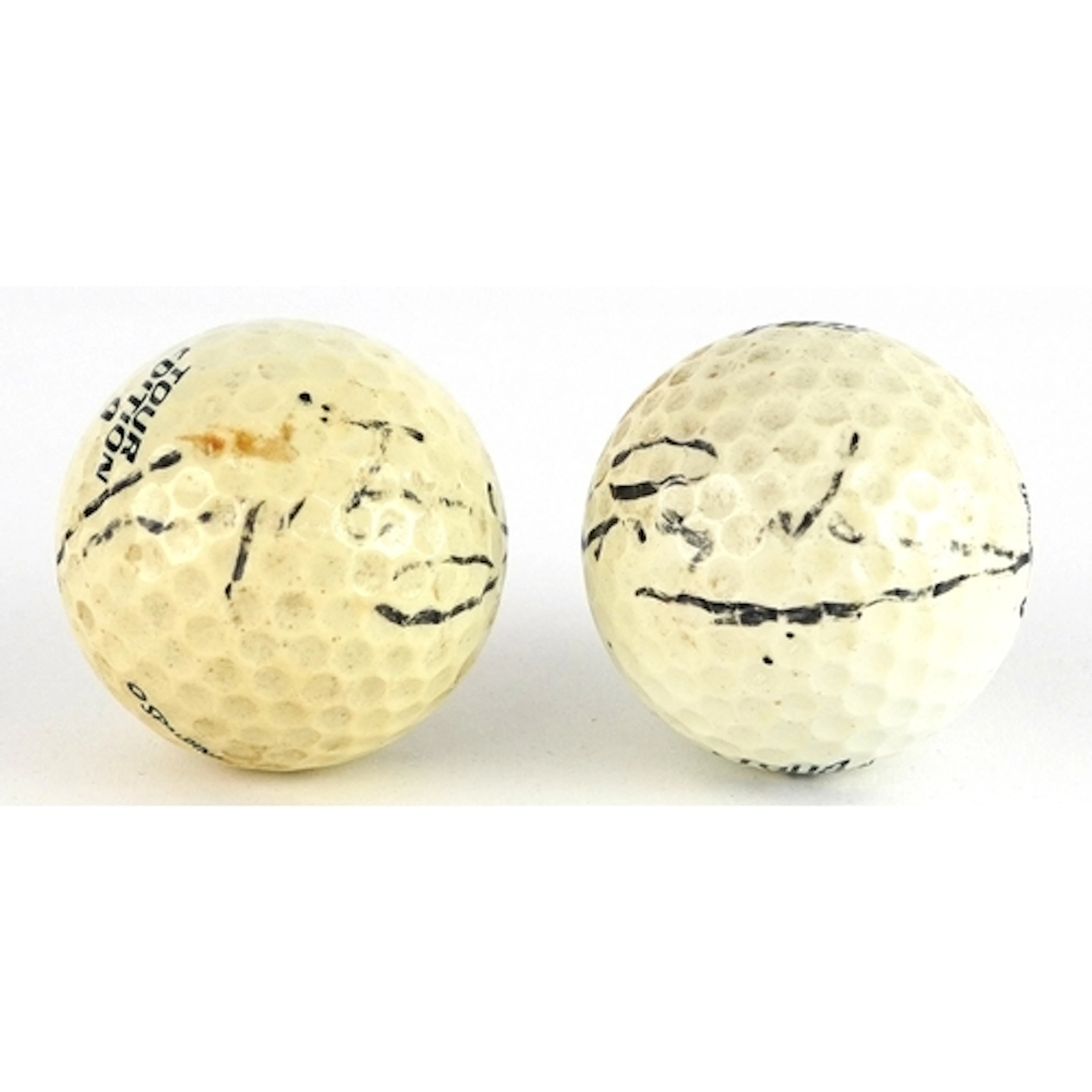 Greg Norman, two signed vintage golf balls.