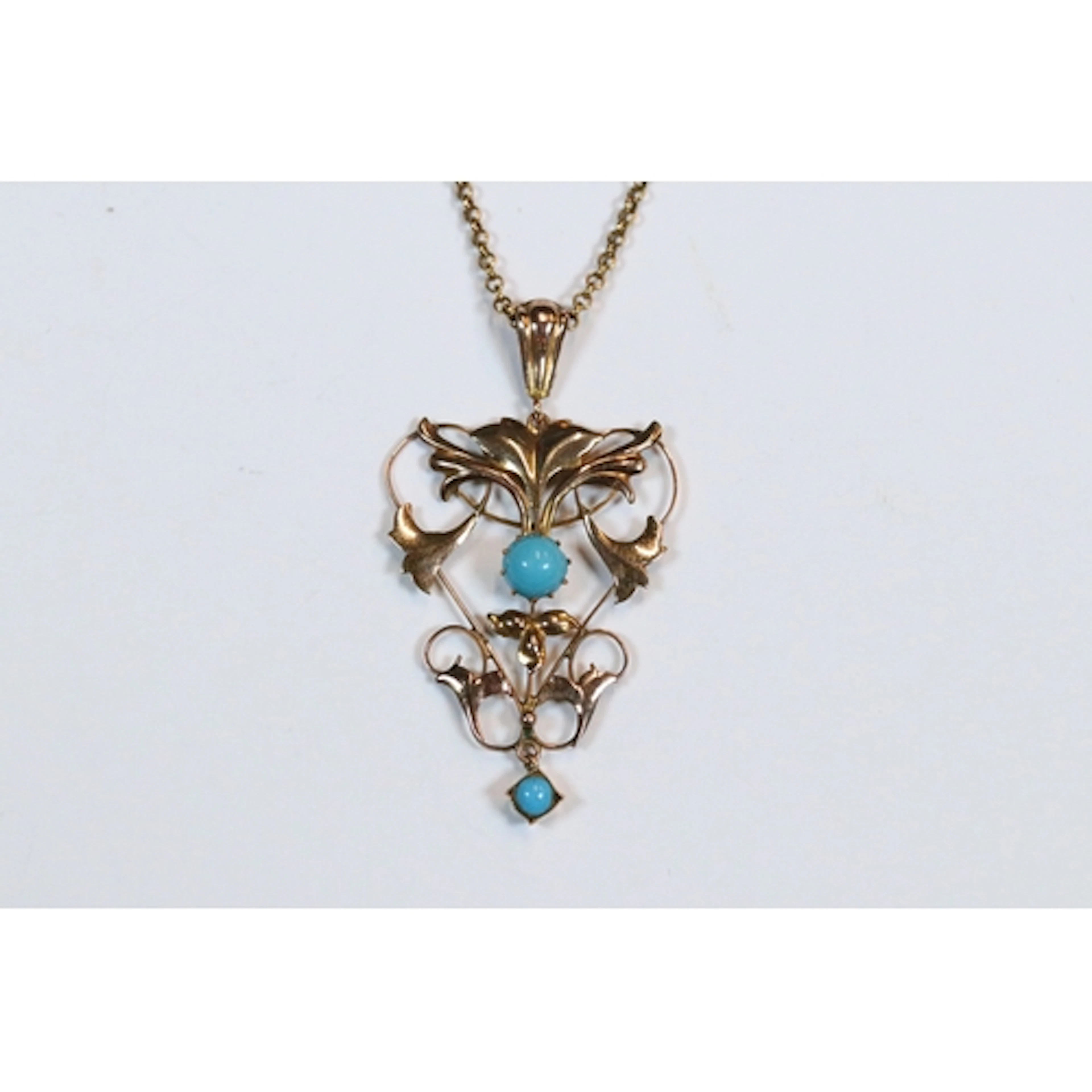 An early 20th century 9ct gold Art Nouveau drop pendant, set...