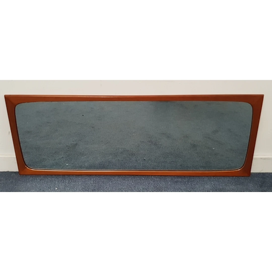 MID-CENTURY TEAK WALL MIRROR with shaped rectangular frame, ...