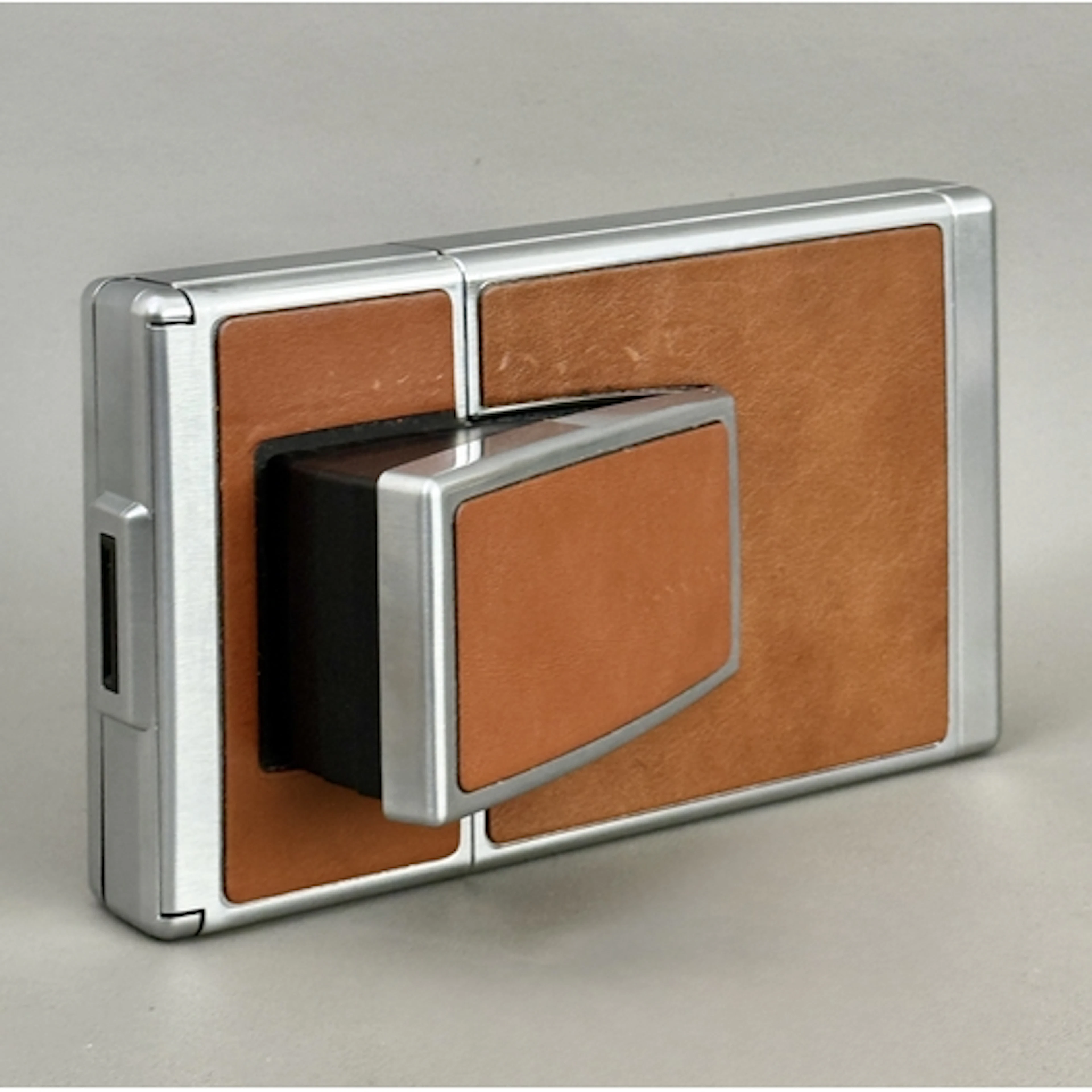 A Polaroid SX-70 Land Camera folding instant film camera wit...