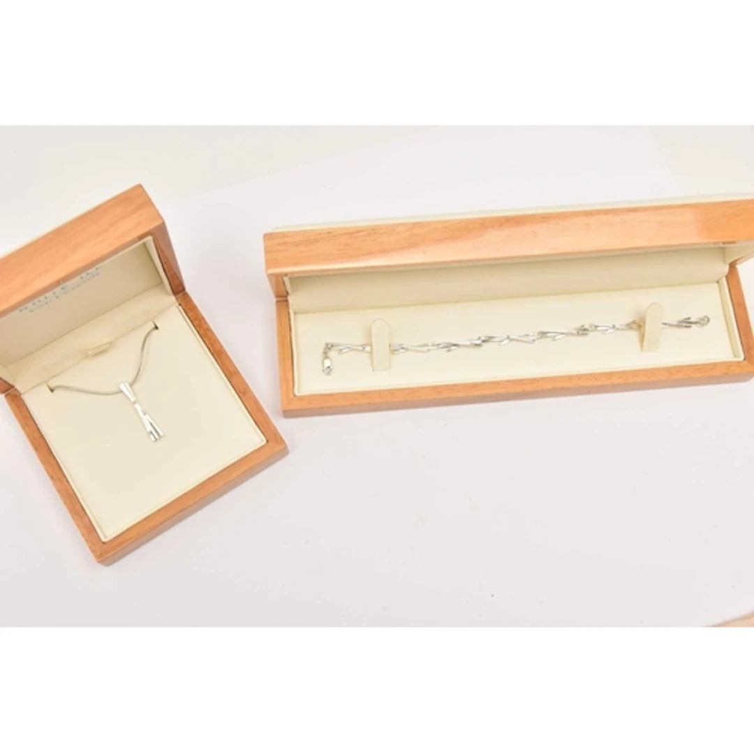 A 'WHITE ICE' SILVER BRACELET AND A MATCHING NECKLACE, a sil...