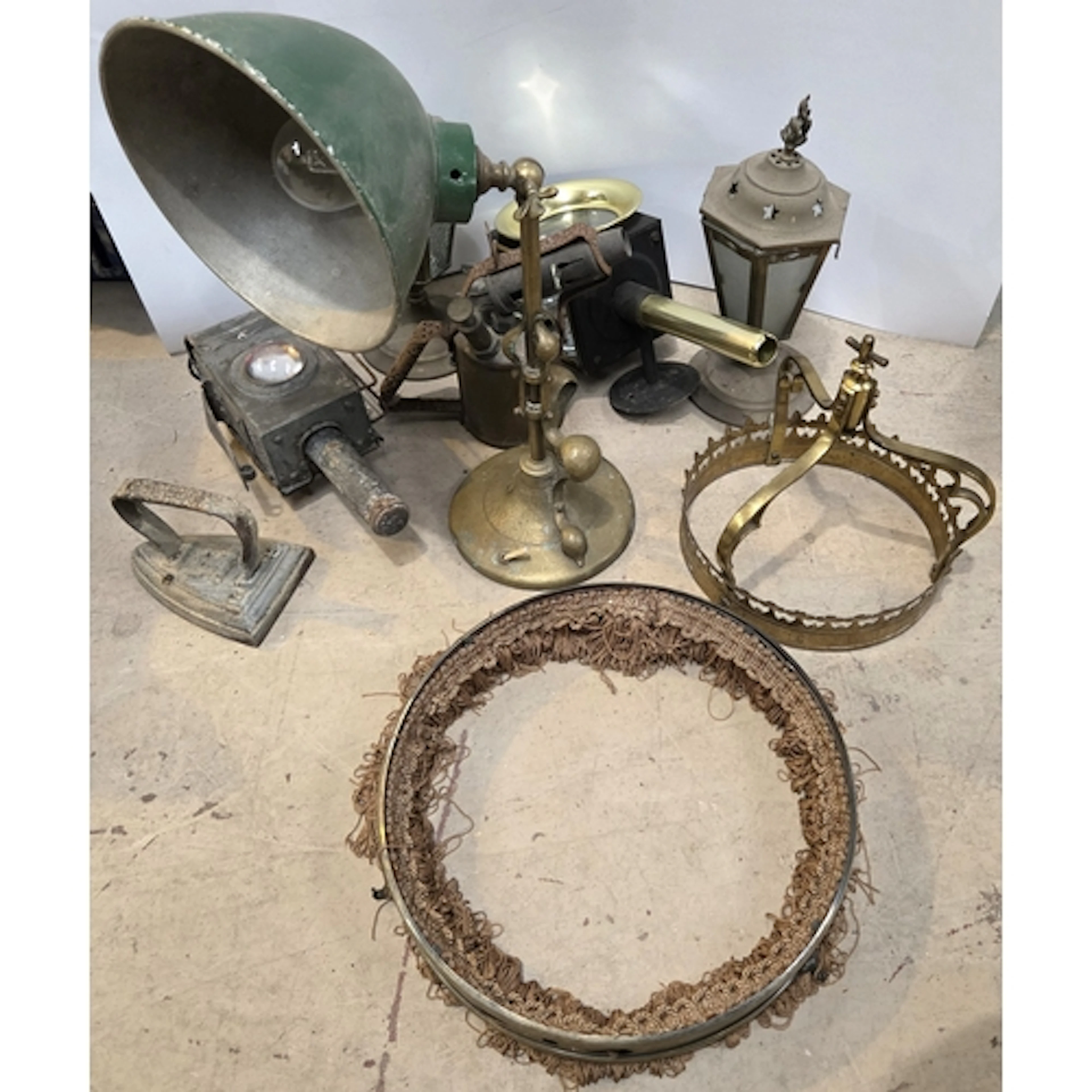 A brass bass Art Nuveau brass based table lamp with green me...