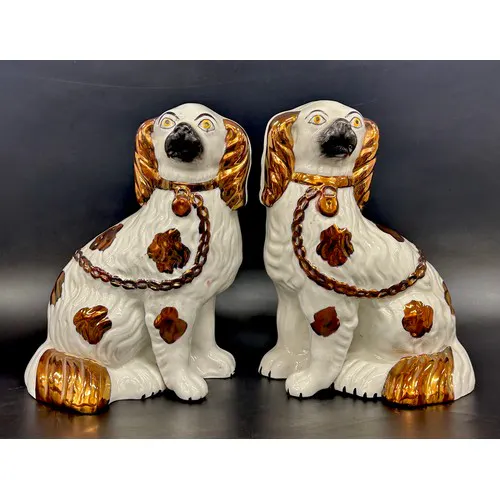 A pair of Staffordshire dogs with copper lustre, 23cm h