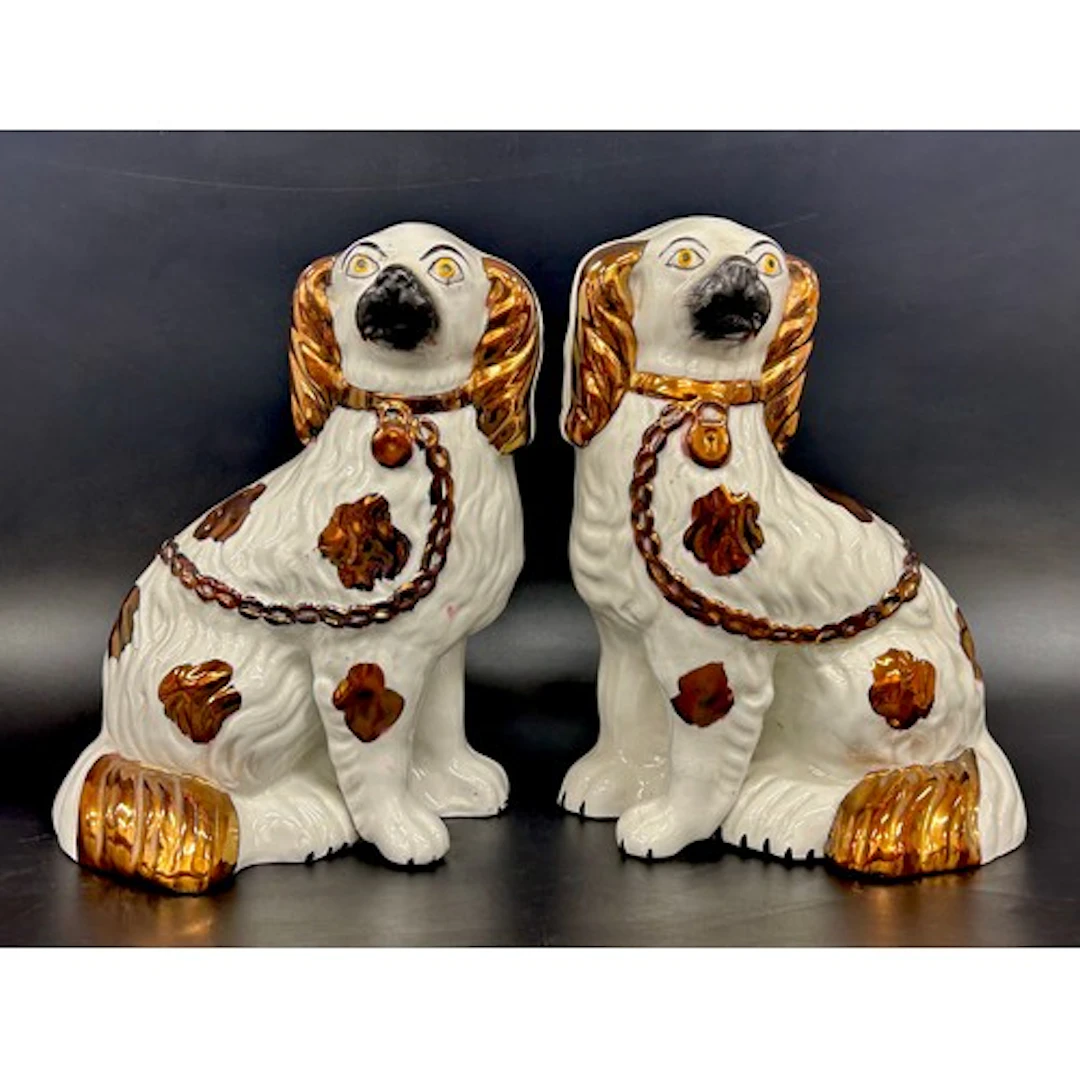 A pair of Staffordshire dogs with copper lustre, 23cm h