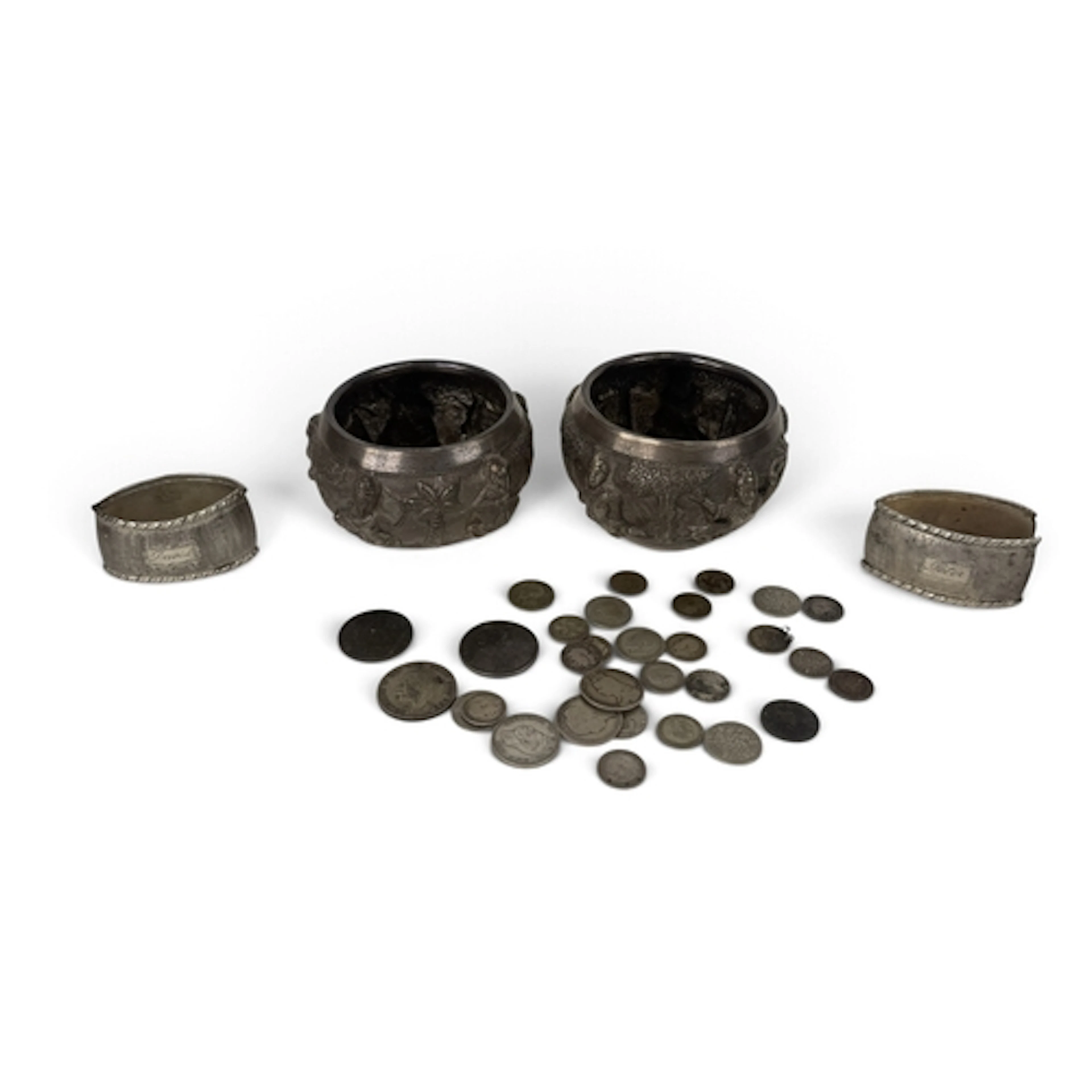 TWO SOUTHEAST ASIAN SILVER BOWLS TOGETHER WITH TWO NAPKIN RI...