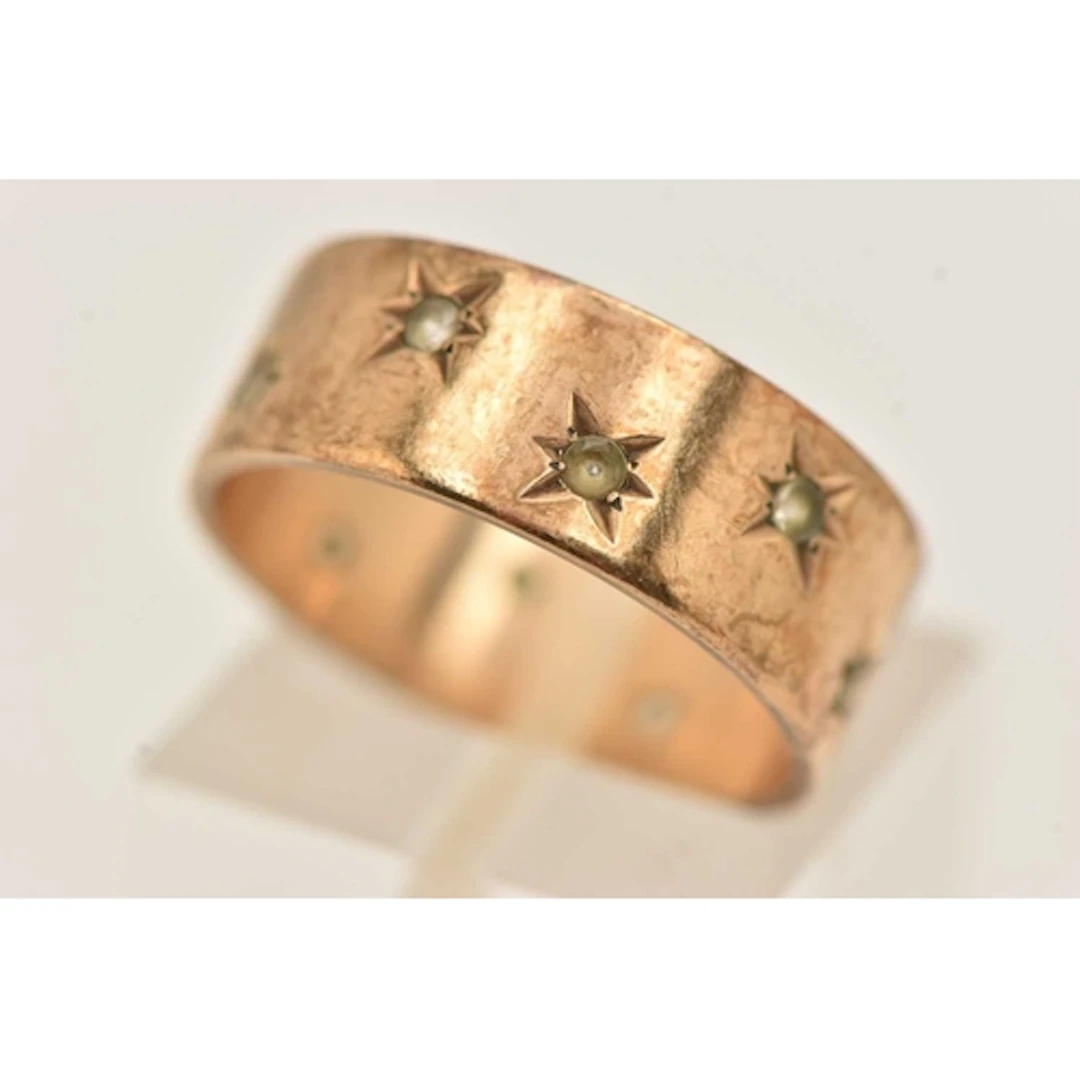 A 9CT GOLD SPINEL SET WIDE BAND RING, AF missing stones, app...