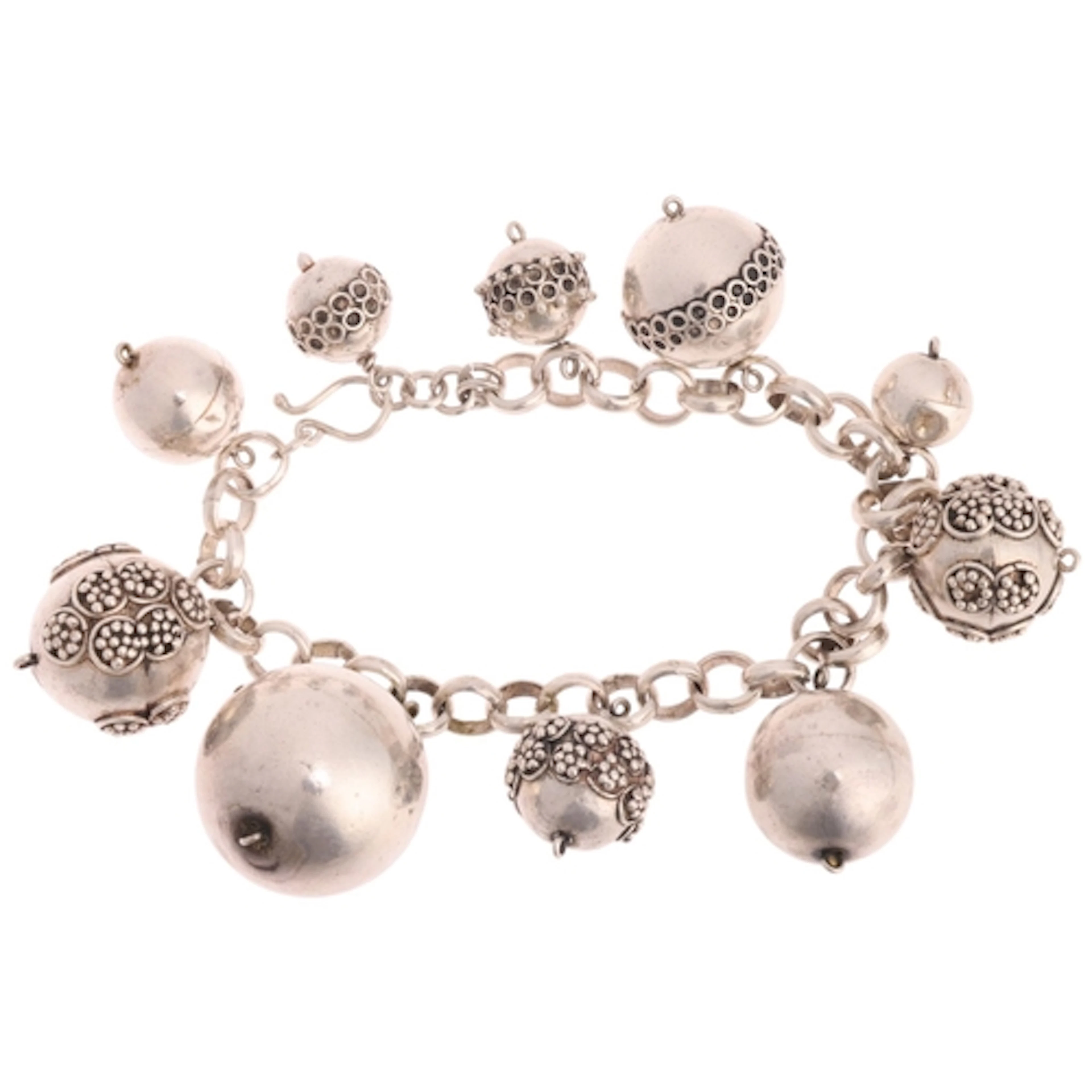 An Indonesian silver bead charm bracelet, beads measure: 23....