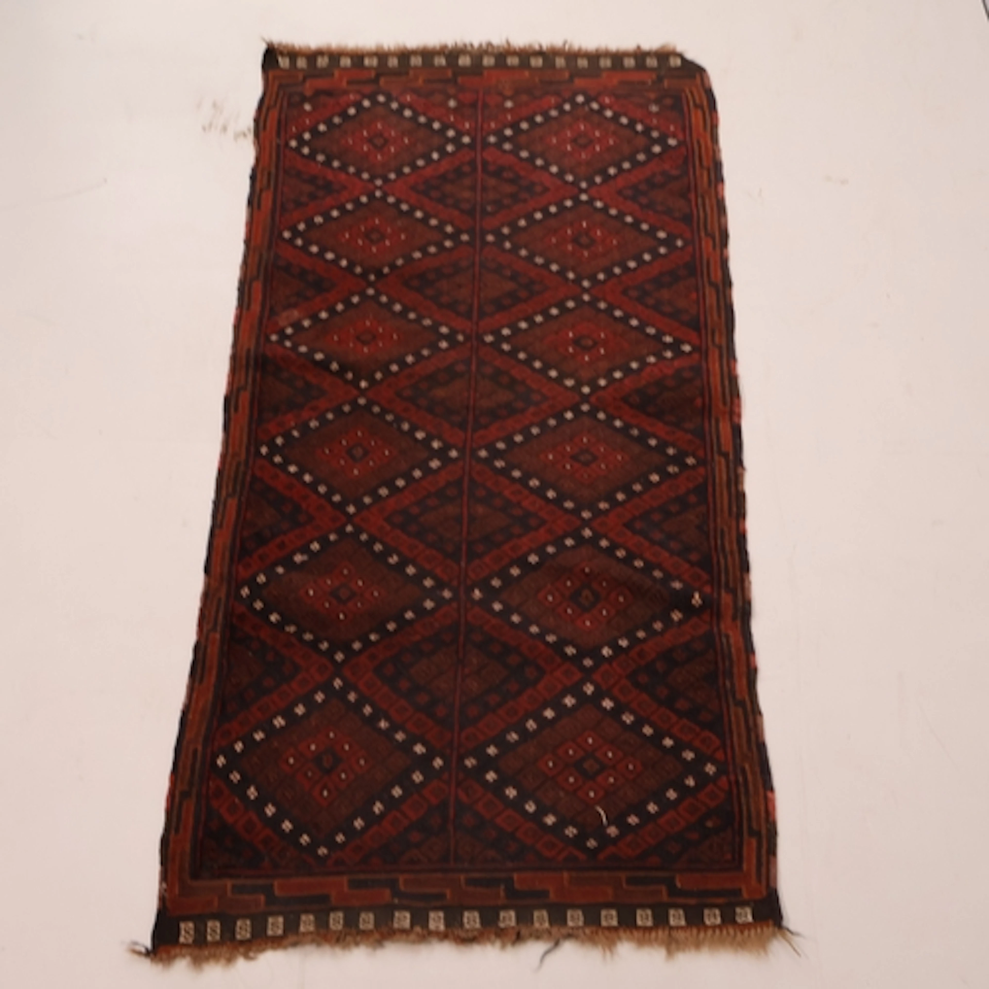 A red ground Afghan Baluchi rug, L154cm, W74cm.