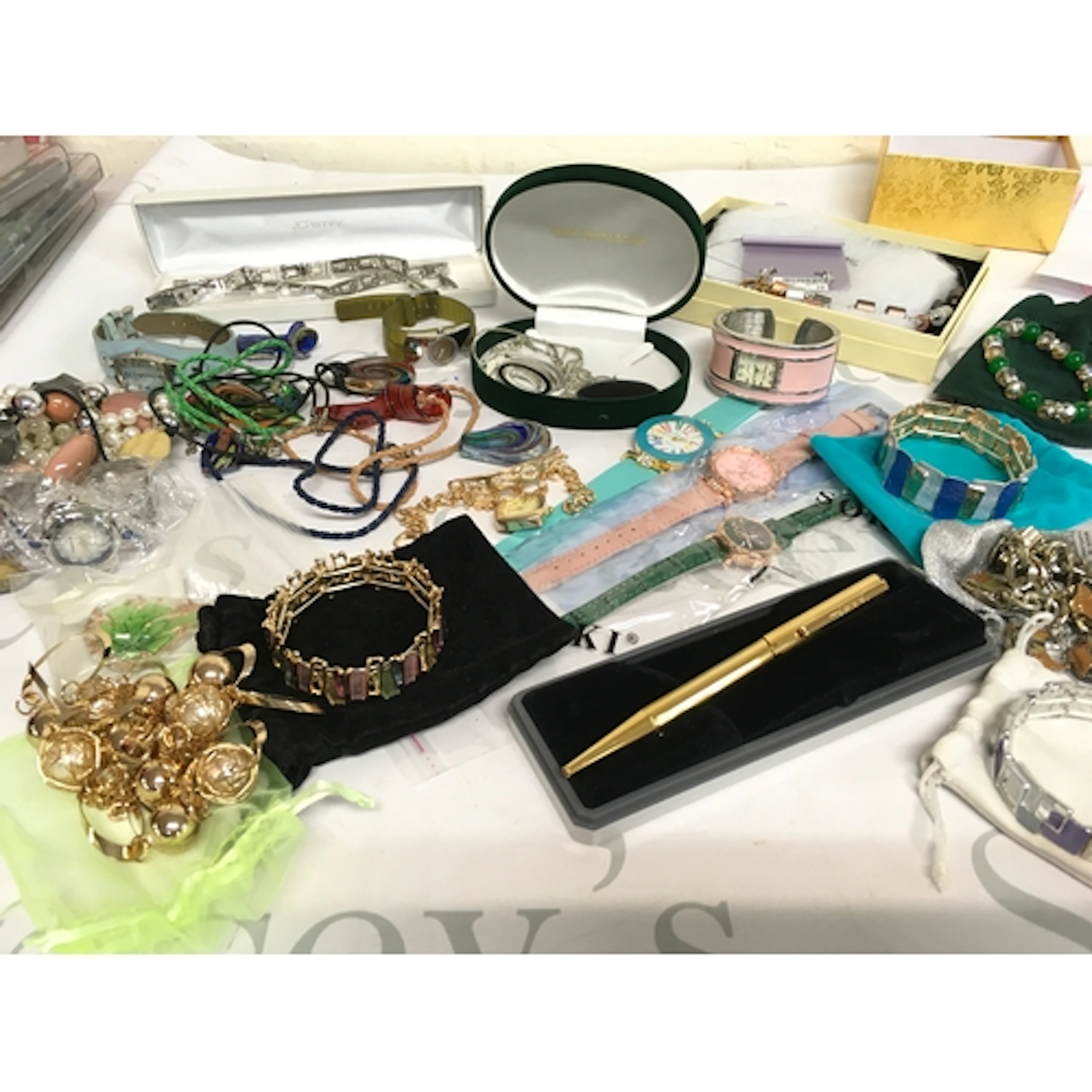 A collection of costume jewellery including bracelets, watch...