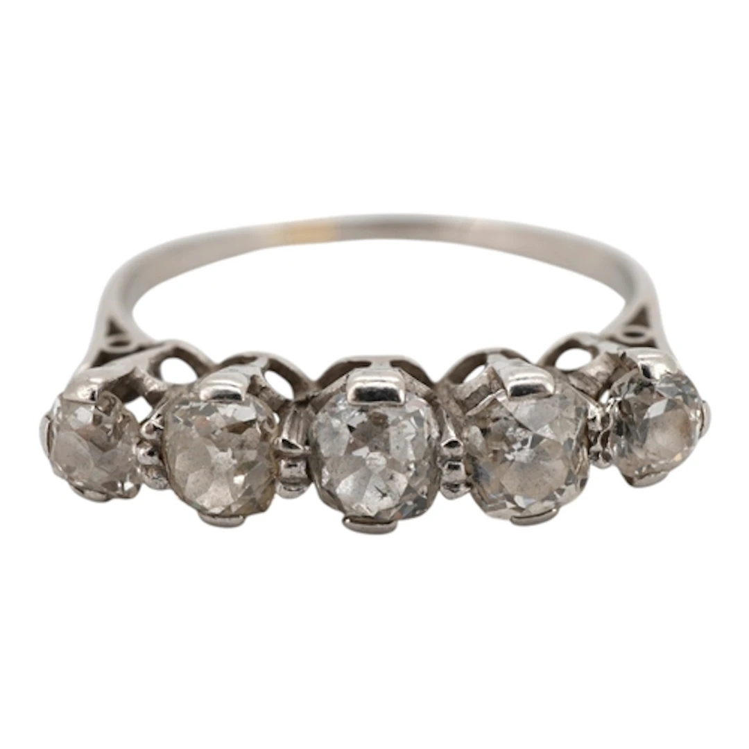 A five-stone diamond ring, early 20th century, claw-set with...