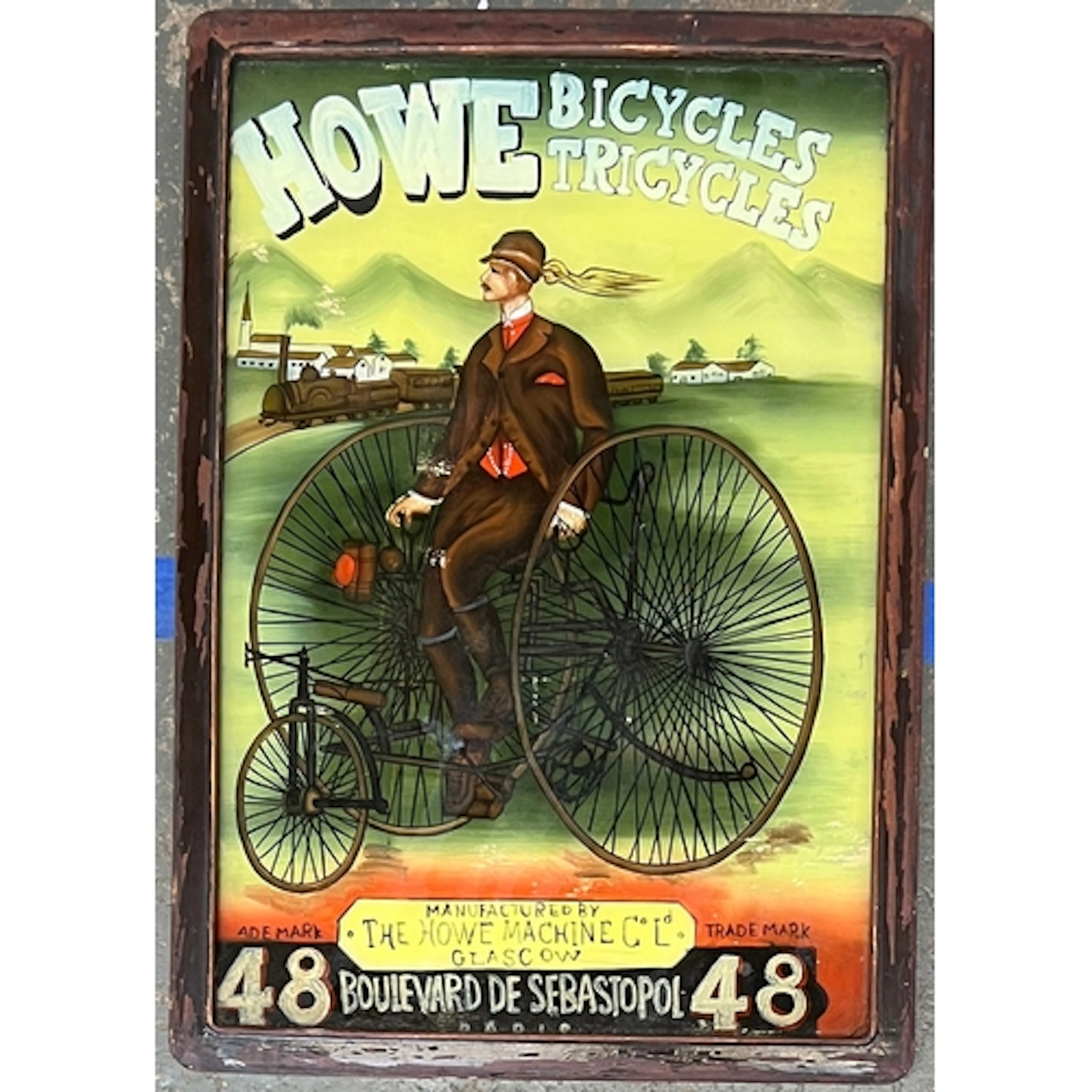 A vintage reverse painted advertisement for Howe Bicycles & ...