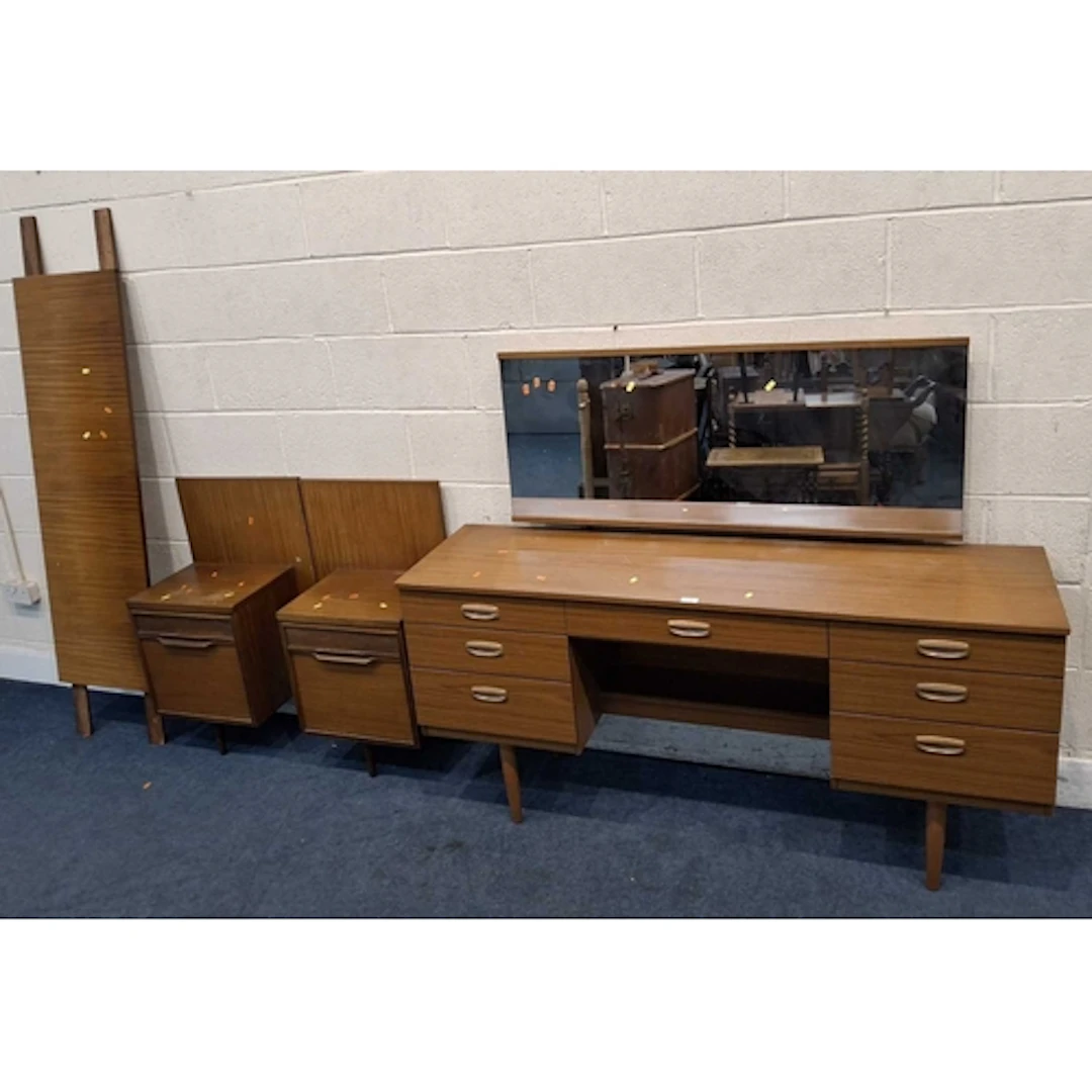 A SCHREIBER MID-CENTURY TEAK EFFECT DRESSING TABLE, with a r...