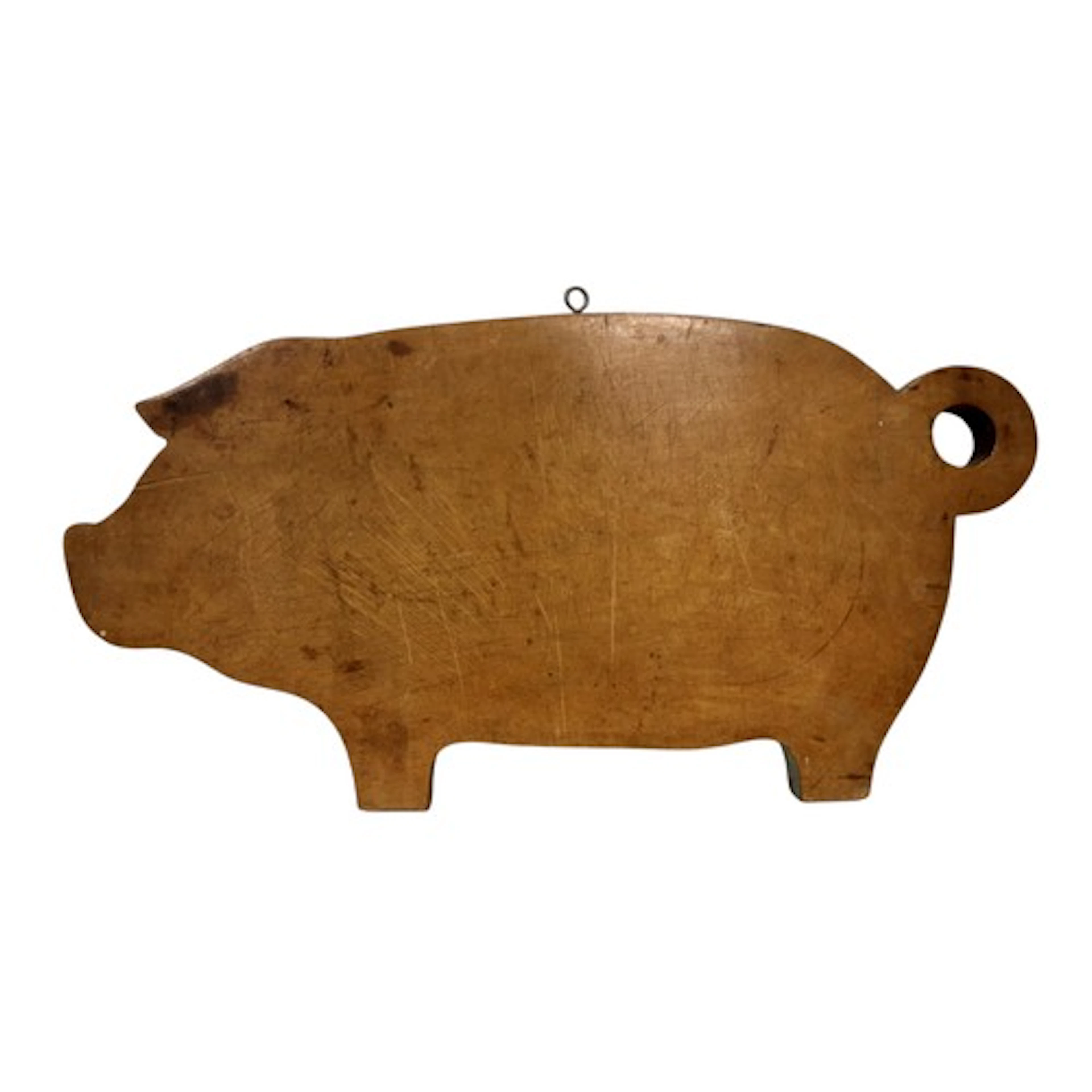 A Continental folk art breadboard in the form of a pig, with...