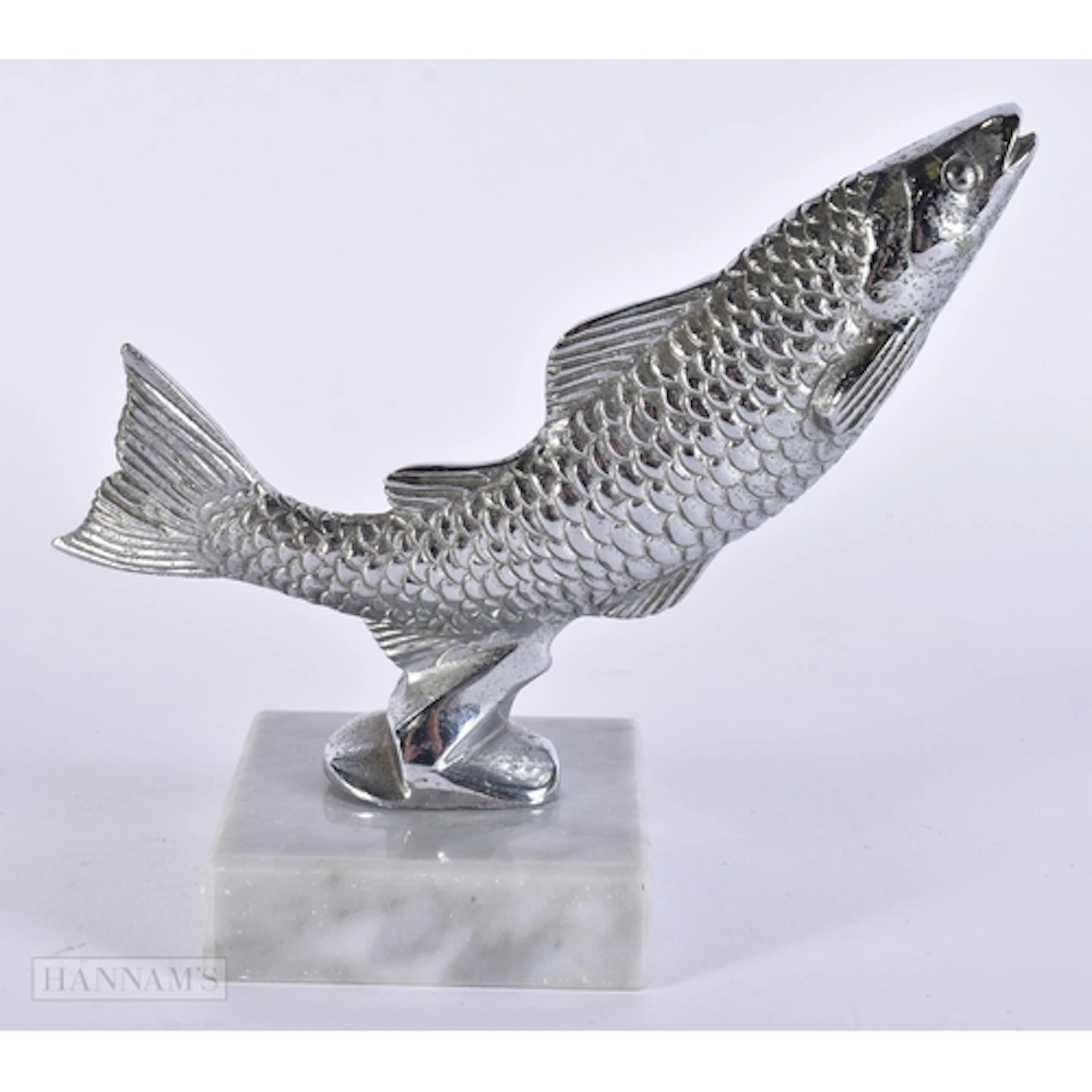 A LEAPING SALMON CAR MASCOT. 13 cm x 10 cm.