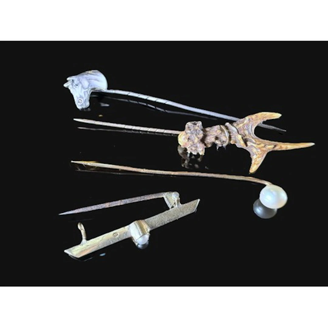 An enamel horse head stick pin, a stick top pin, a yellow me...