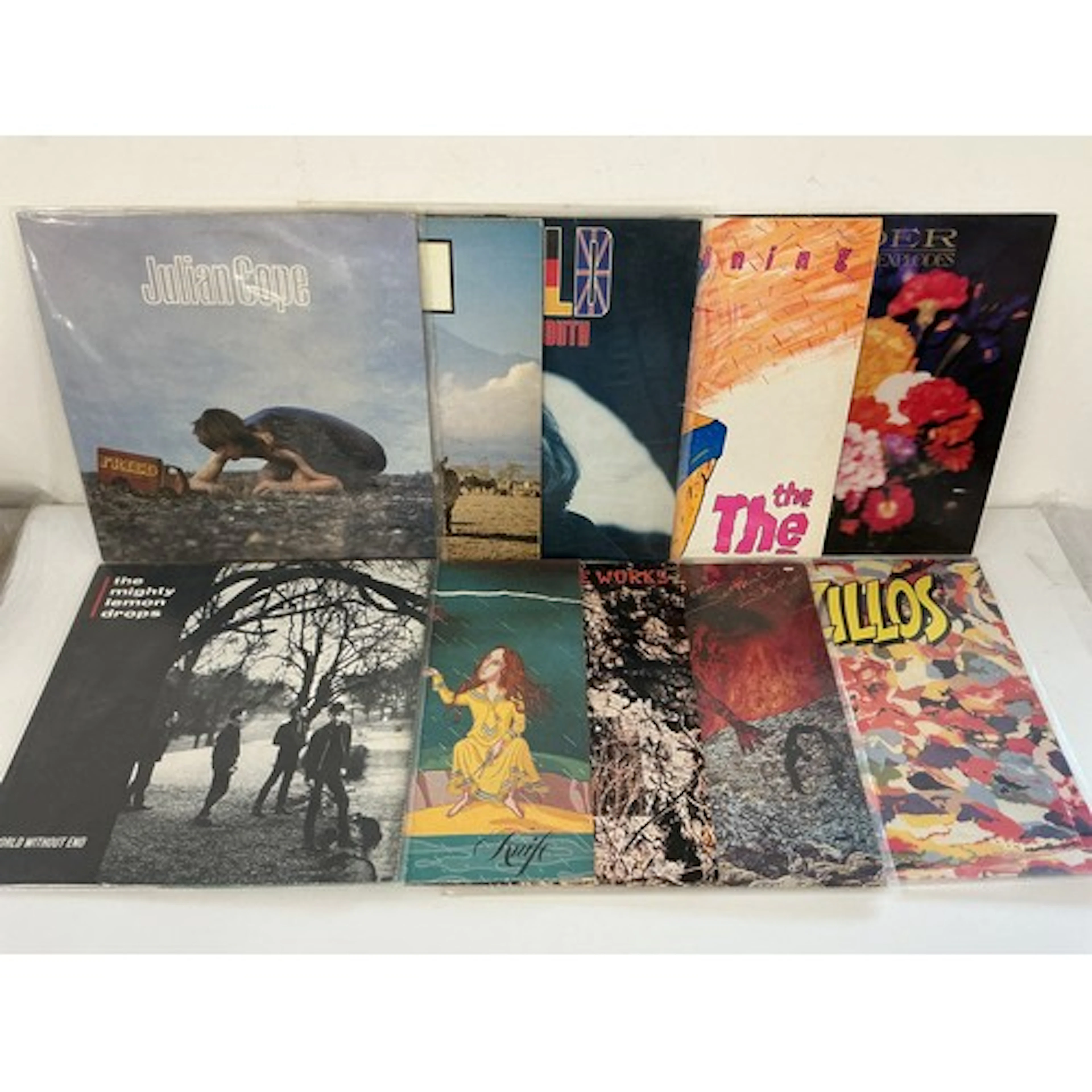 Two bags containing 21 rock and pop LPs and 12” singles by v...