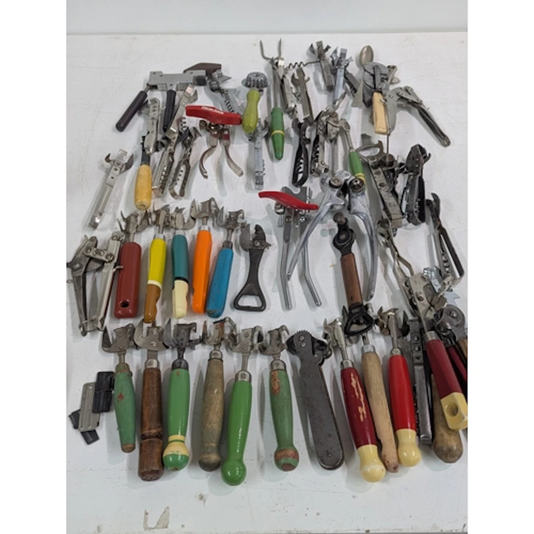 A collection of vintage tin openers along with corkscrews Lo...