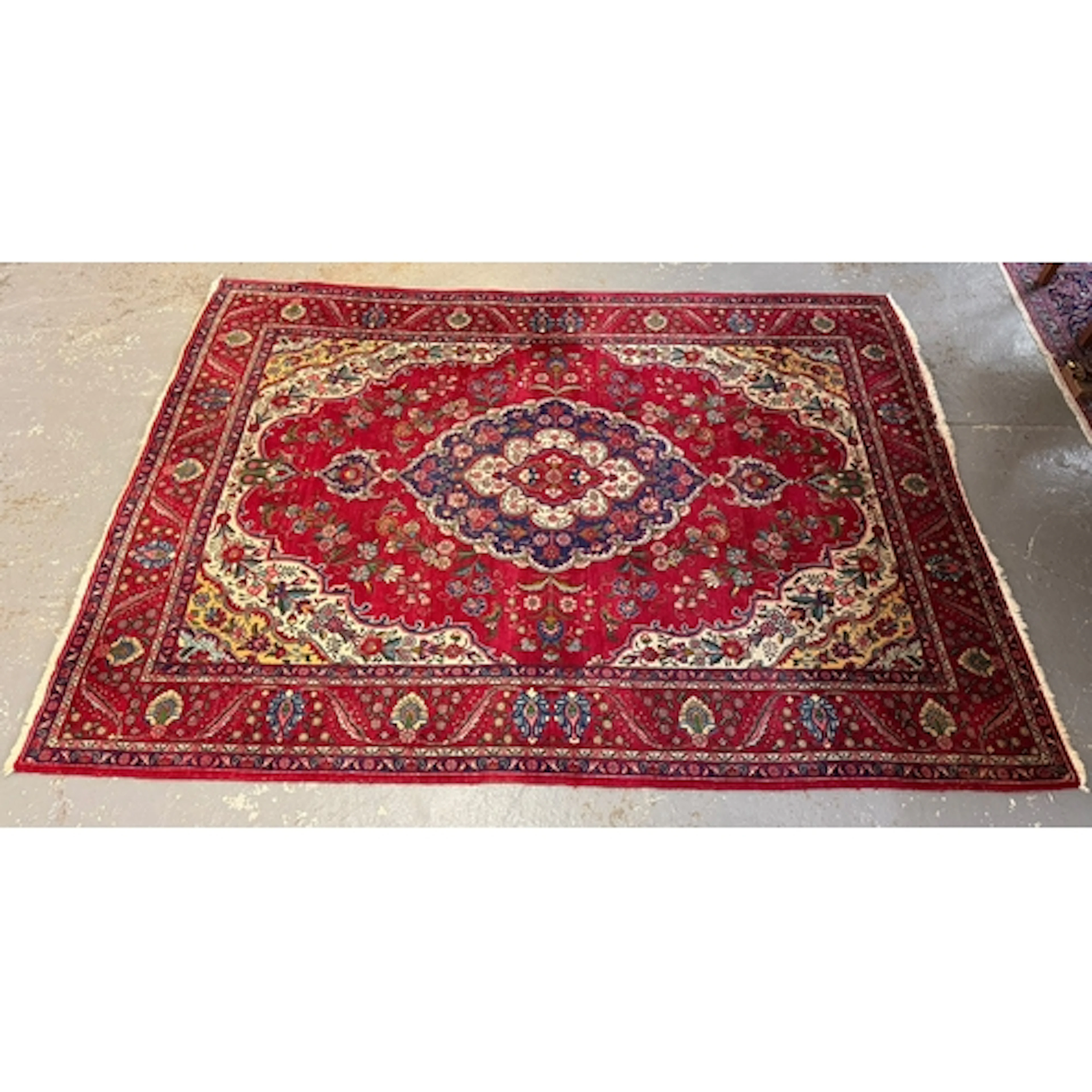 Large Persian style woollen carpet on a red ground with intr...