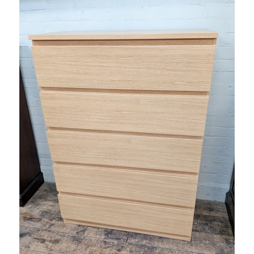 A modern light oak finished five drawer chest, 3' wide