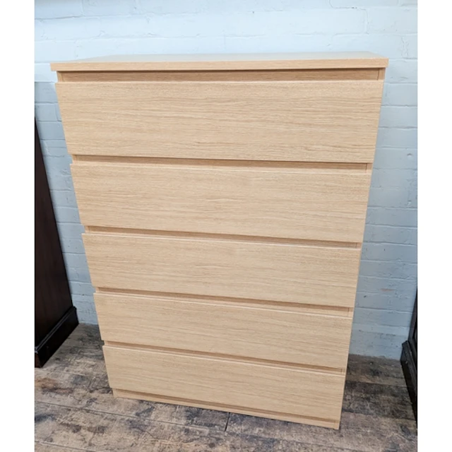 A modern light oak finished five drawer chest, 3' wide