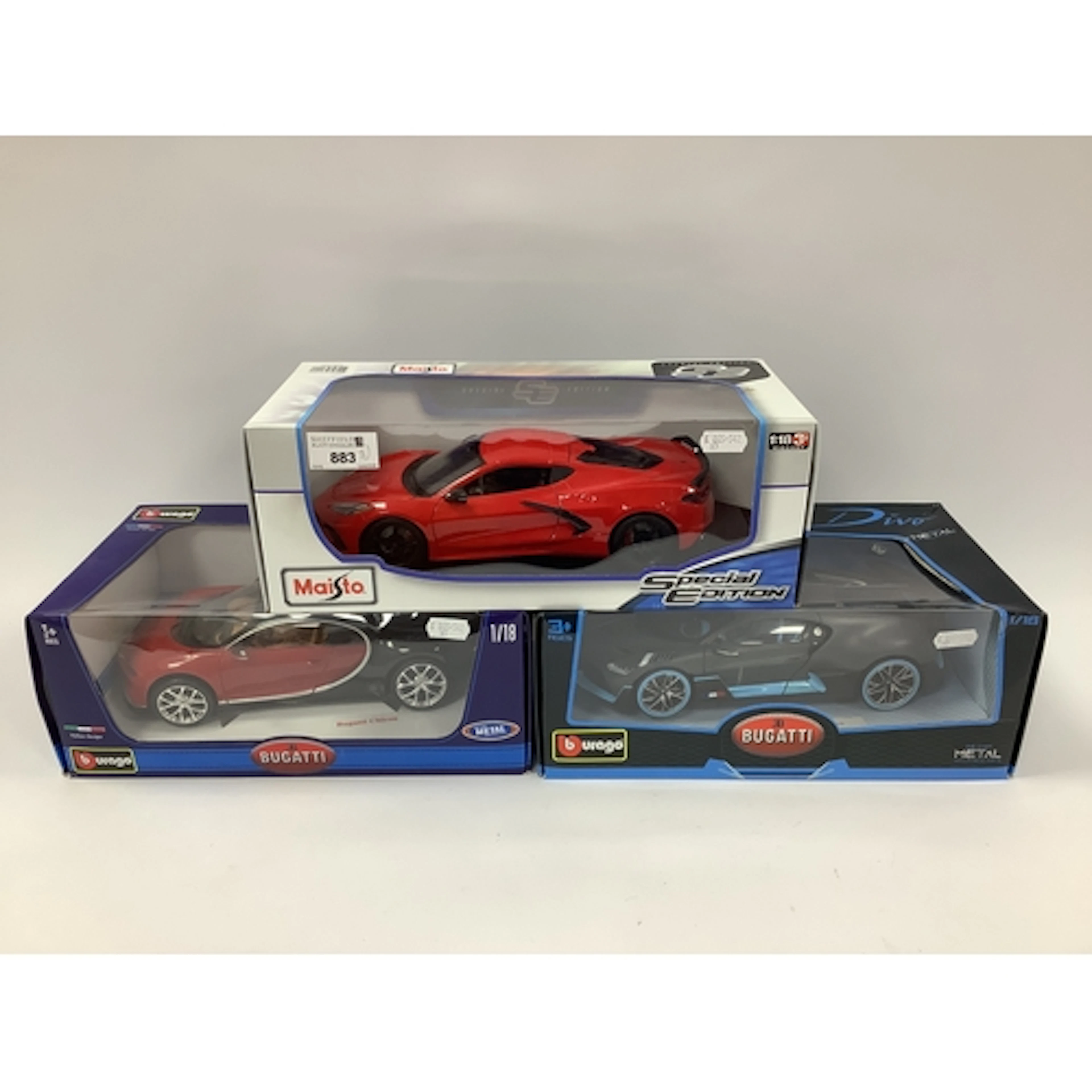 Three 1:18th scale diecast model sports cars by Burago, Mais...