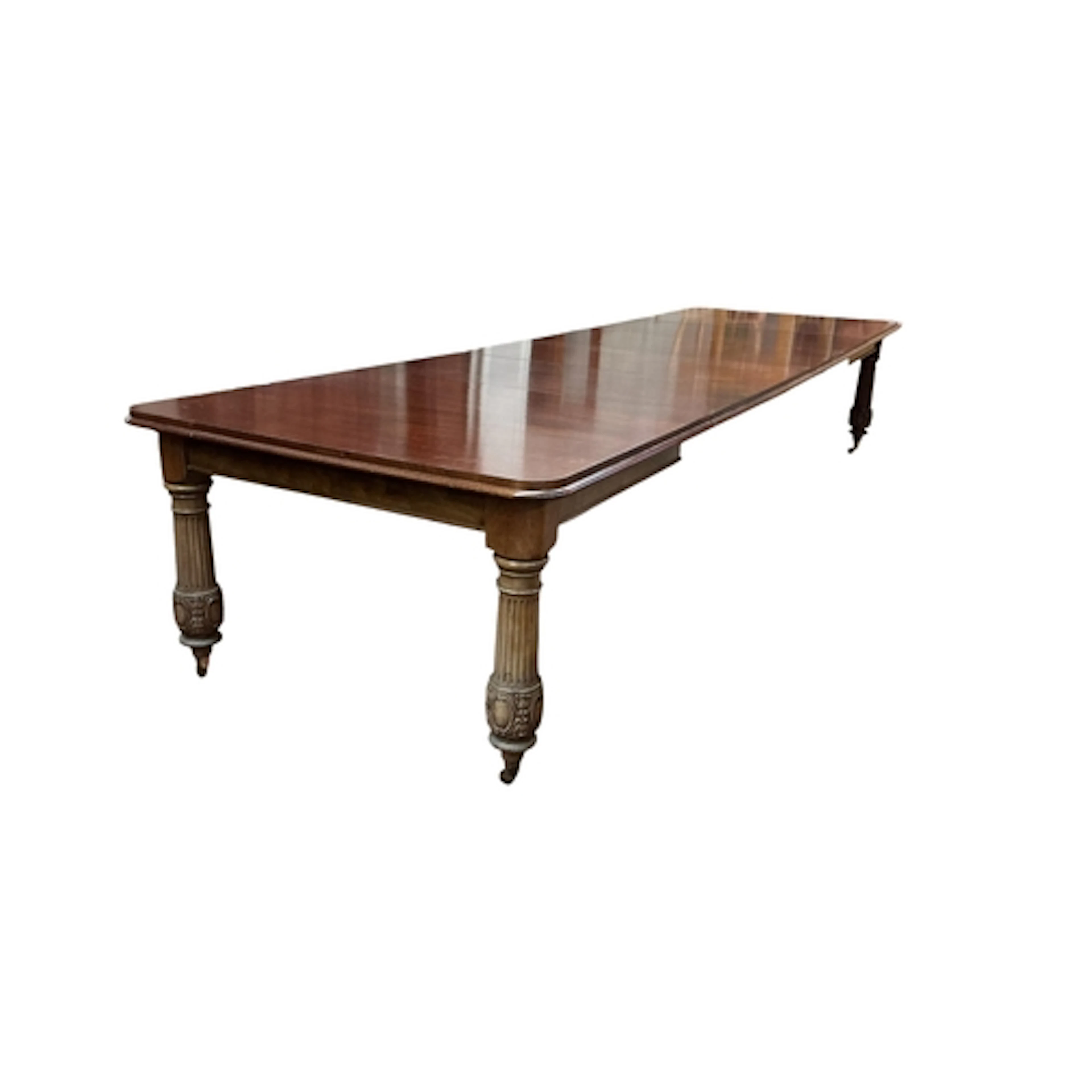 A Victorian style mahogany dining table with four spare leav...