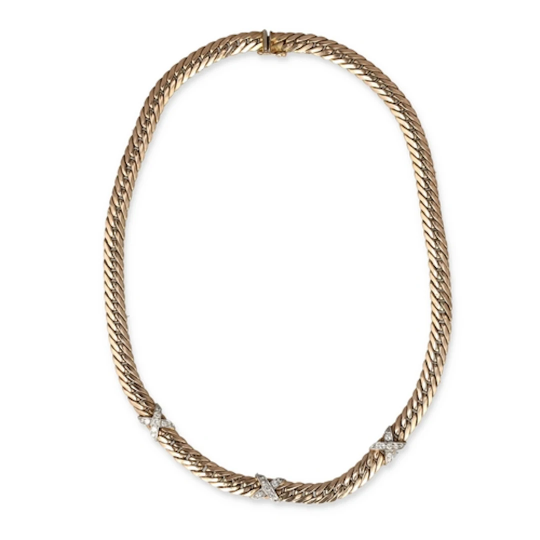 A 9CT GOLD NECKLACE INTERSPACED WITH THREE DIAMOND SET CROSS...