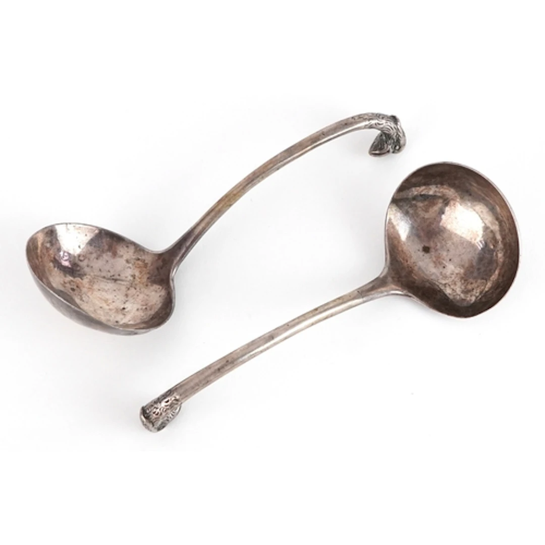 Pair of antique silver ladles with bird head handles, indist...
