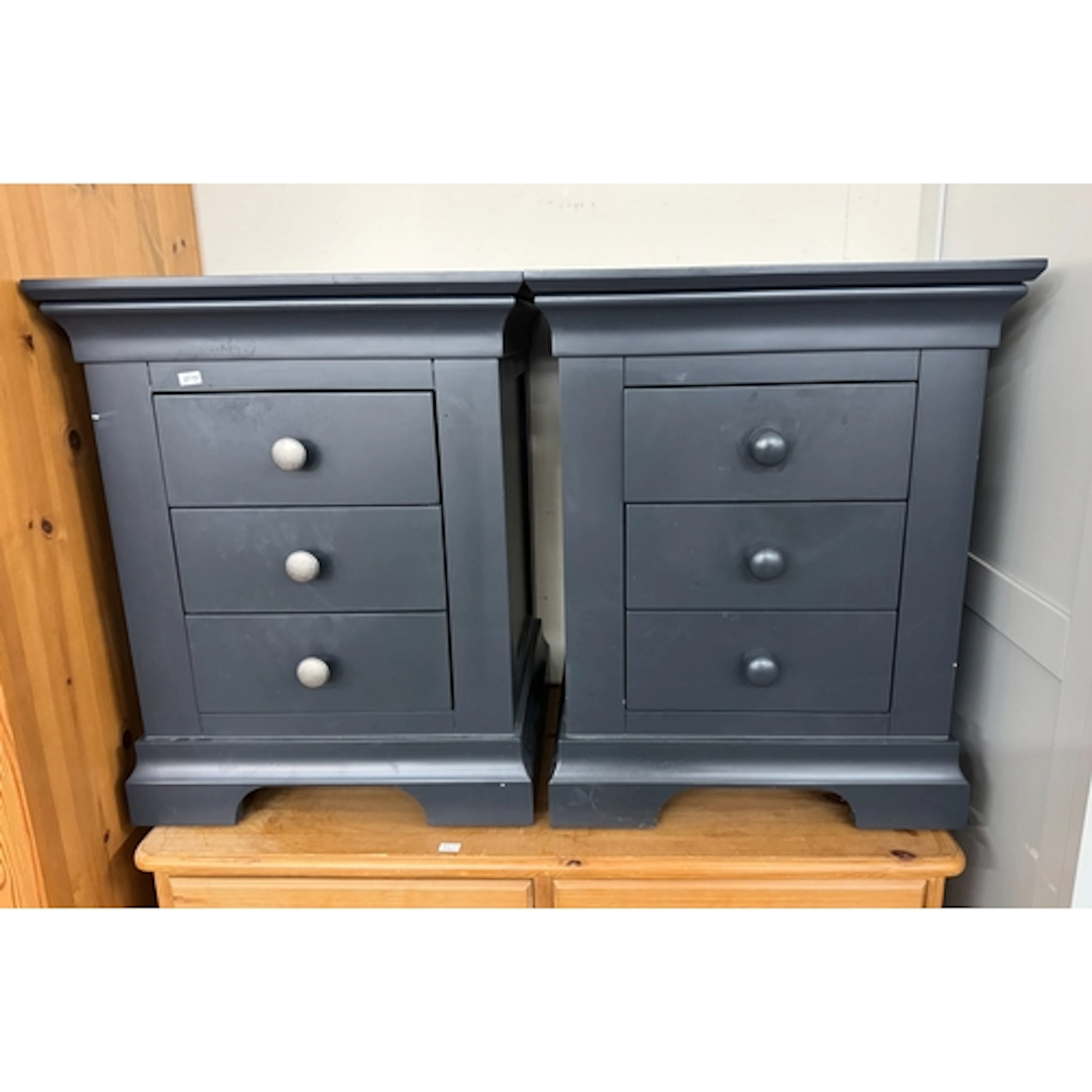 A pair of modern ink blue bedside cabinets fitted three draw...