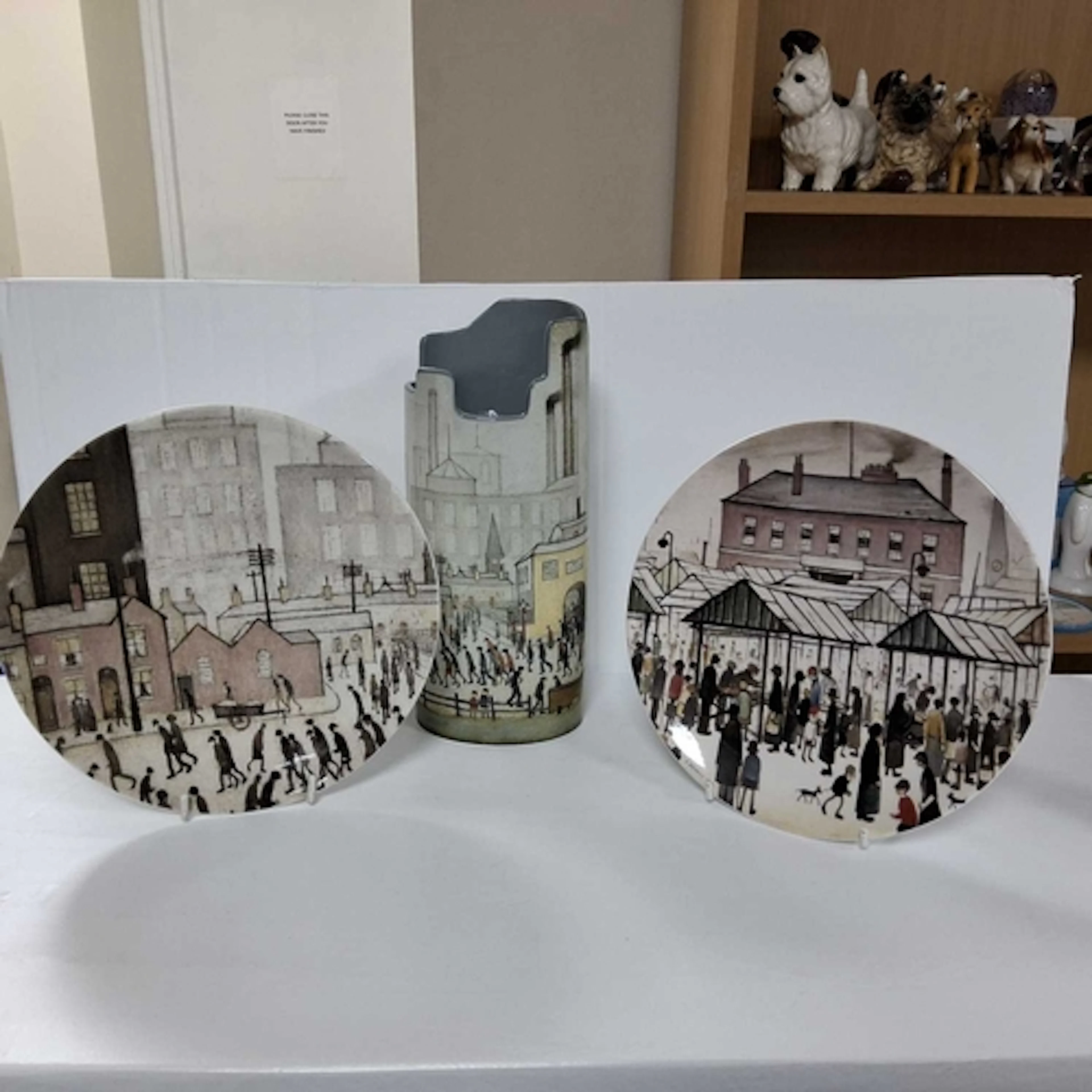 A BESWICK L S LOWRY VASE AND TWO QUEENS PLATES comprising a ...