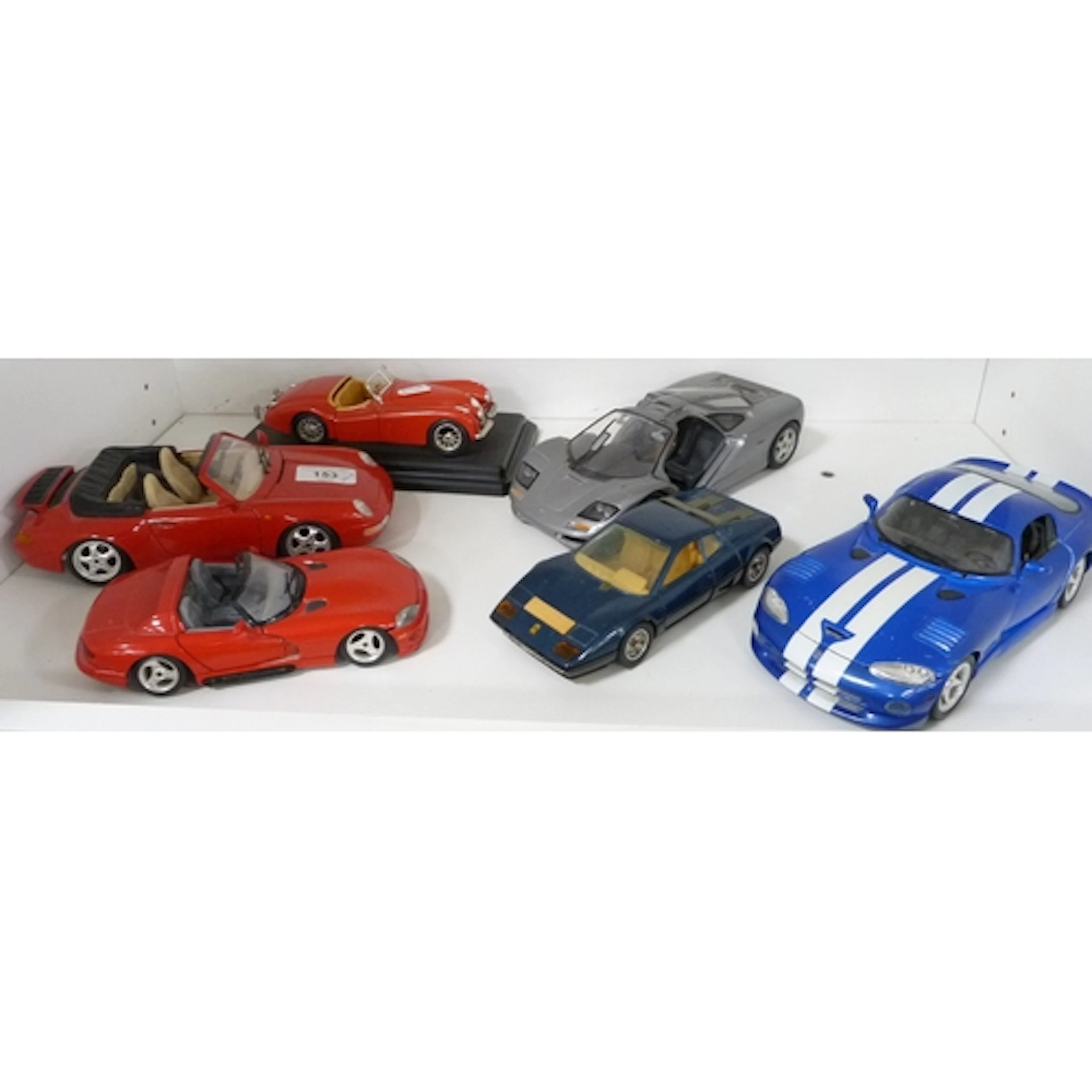 Shelf lot of model cars to include Burago Porsche Carrera 91...