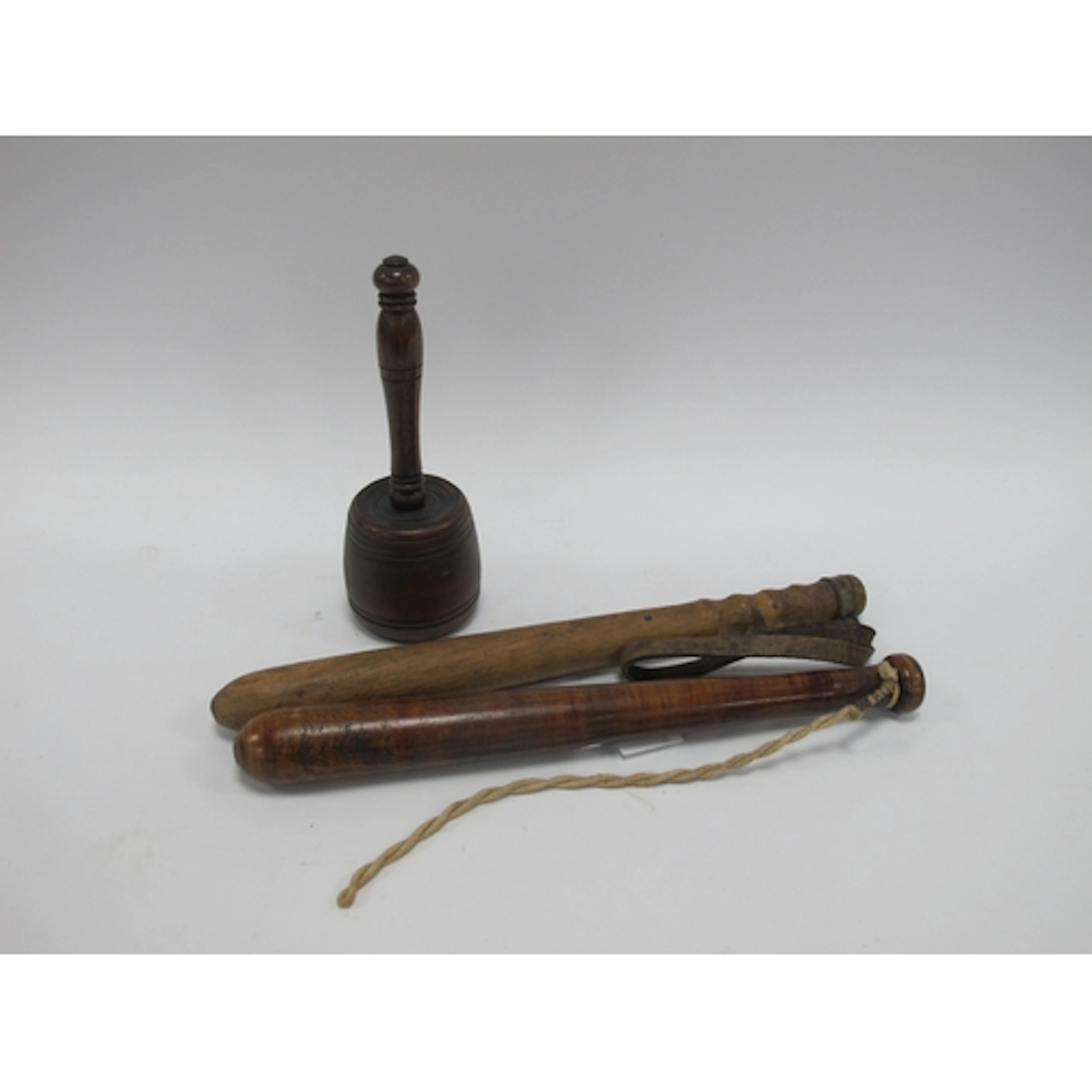 Two vintage English wooden truncheons, one with leather wris...
