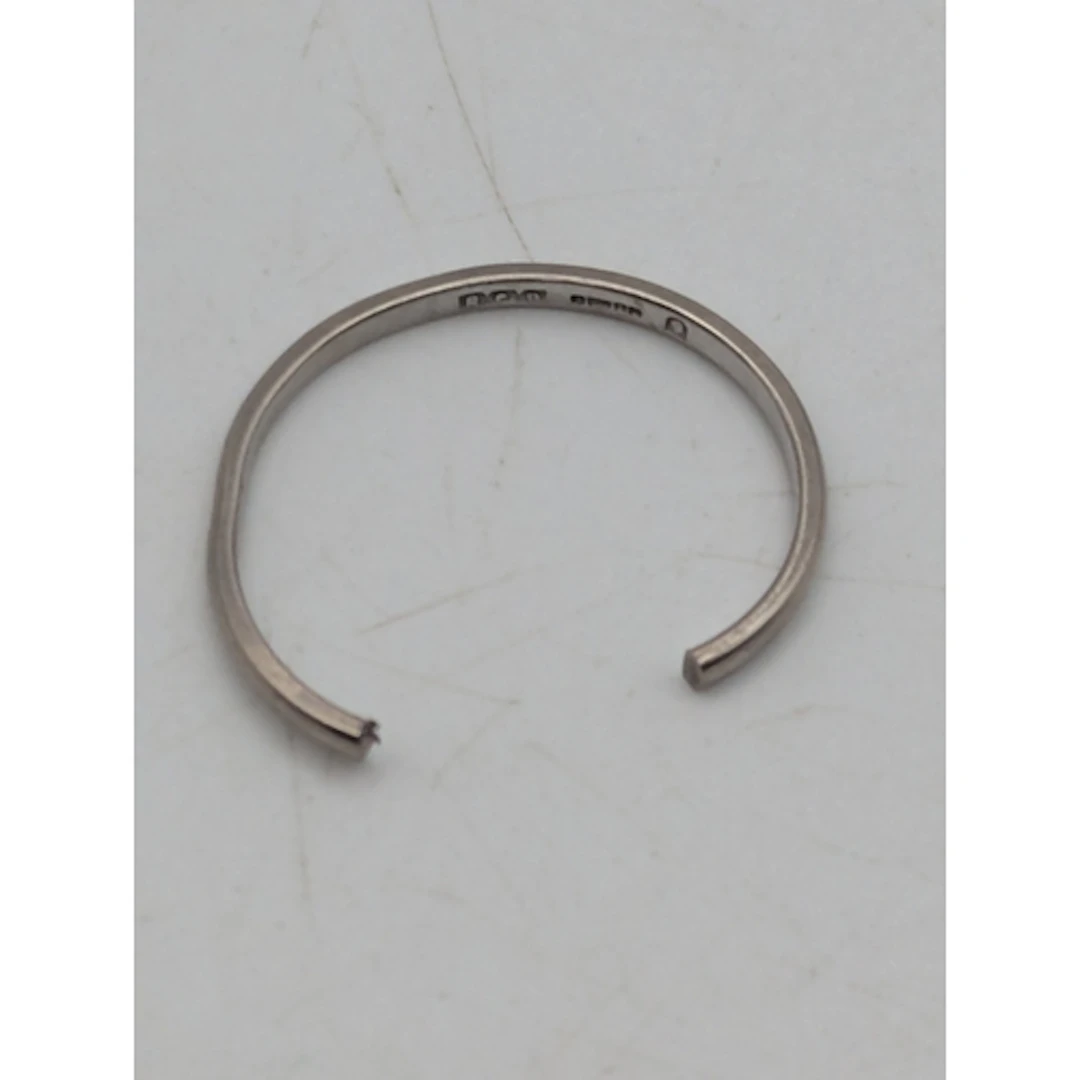 An 18ct white gold wedding band A/F, stamped 750 with Britis...