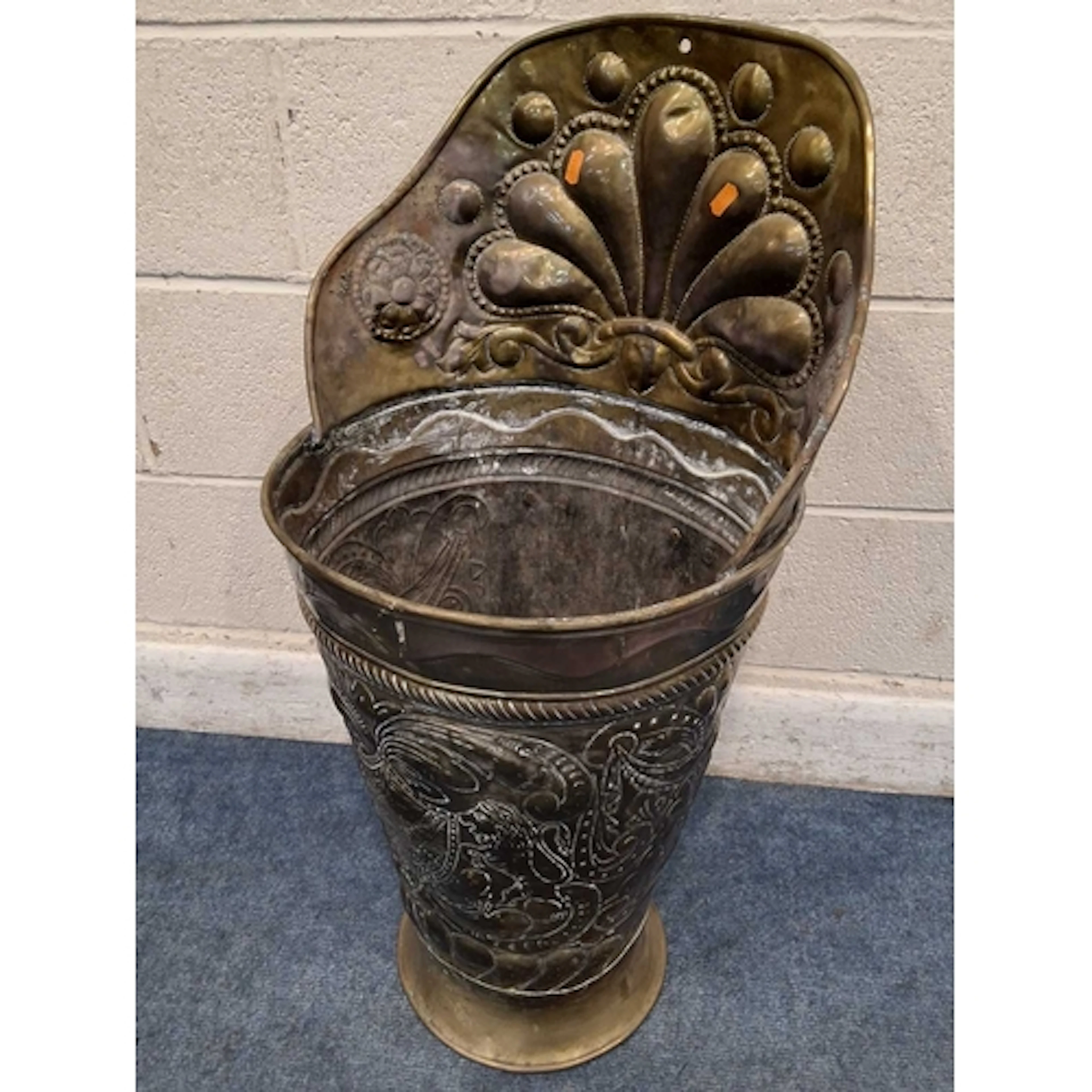 A BRASS CYLINDRICAL TAPERED GRAPE HOD, with various scrolled...